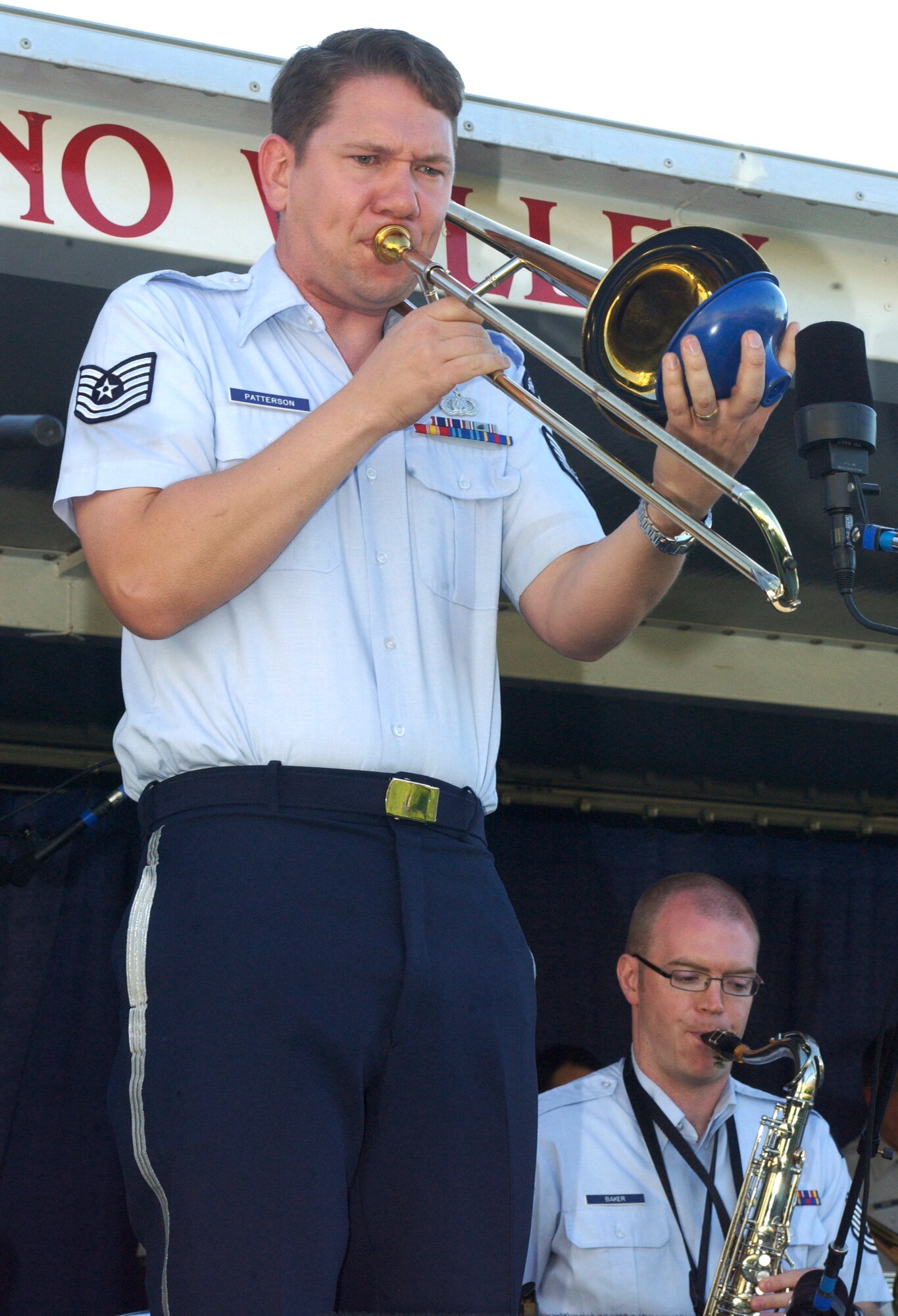 As the sun sank Monday evening the sounds of trombonist Master Sgt. Benjamin Patterson and the Air Force's Airmen of Note could be heard drifting across the horizon. Over 100 people from March Air Reserve Base and the around the community, including Brig. Gen. James Melin, 452nd Air Mobility Wing commander, gathered on the lawn of the March Field Air Museum in Moreno Valley, Calif., for the sunset performance. The opening song, "No I don't fly planes," composed by one of the bands members, started off the evenings show with a little humor and a lot of talent. Airmen of Note, the Air Force's premier jazz ensemble which began in the '70s, came to the museum to put on a free concert as part of the Air Force's 60th Anniversary. The previous day they had preformed at nearby Disneyland. Some of the many songs included "Search for peace," which incorporated a trombone solo by Sergeant Patterson and "I love being here," sung by the band's vocalist Tech. Sgt. Paige Martin.                              