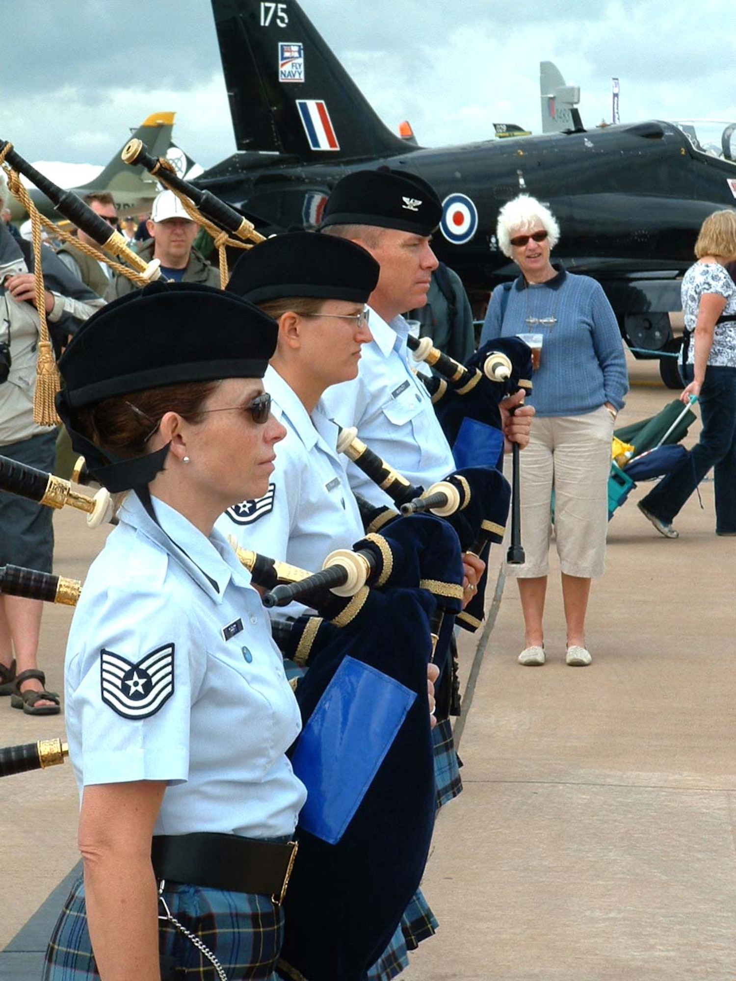 FAIRFORD, United Kingdom -- (From left) Tech. Sgt. Janis Thrift, Tech. Sgt. Kara Frank and Col. William McKinley, bagpipers with the band of the U.S. Air Force Reserve, prepare to perform for the more than 200,000 spectators attending the Royal International Air Tattoo at Royal Air Force Base Fairford.  (U.S. Air Force photo/Staff Sgt. Eric Frank)