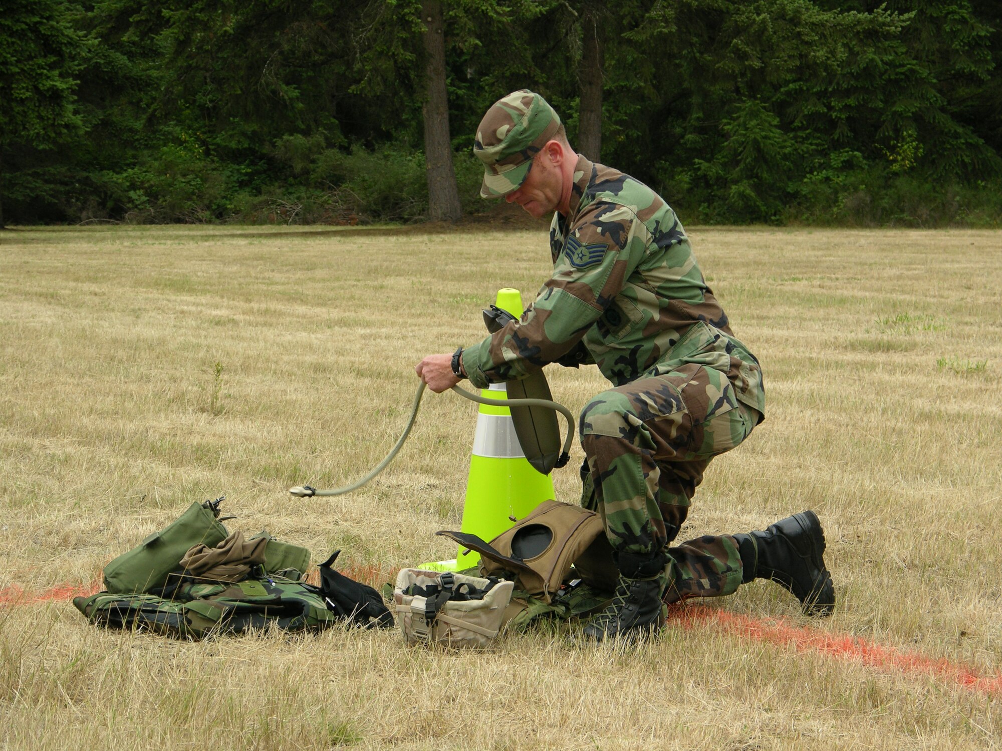 SEYMOUR JOHNSON AIR FORCE BASE, N.C. -- After filling his water pouch, Staff Sgt. Stephen Green prepares the rest of his equipment for the Air Mobility Command's Rodeo 2007 and the scanerio that was assigned to the two members of the 916th Security Forces Squaadron.  Sergeant Green is a fire team member with the 916th SFS.