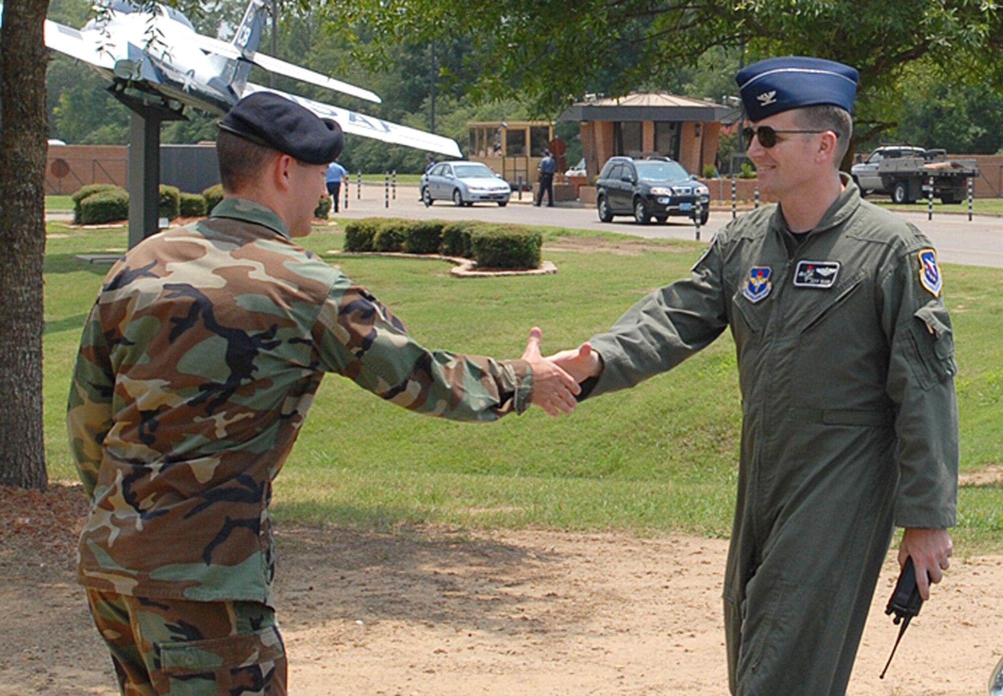 Colonel Jeff Dunn, 14th Flying Training Wing vice commander, is welcomed to the 14th Security Forces Squadron by their commander, Major Kiley Stinson, during his immersion Aug. 2. (U.S. Air Force Photo by Elizabeth Owens)