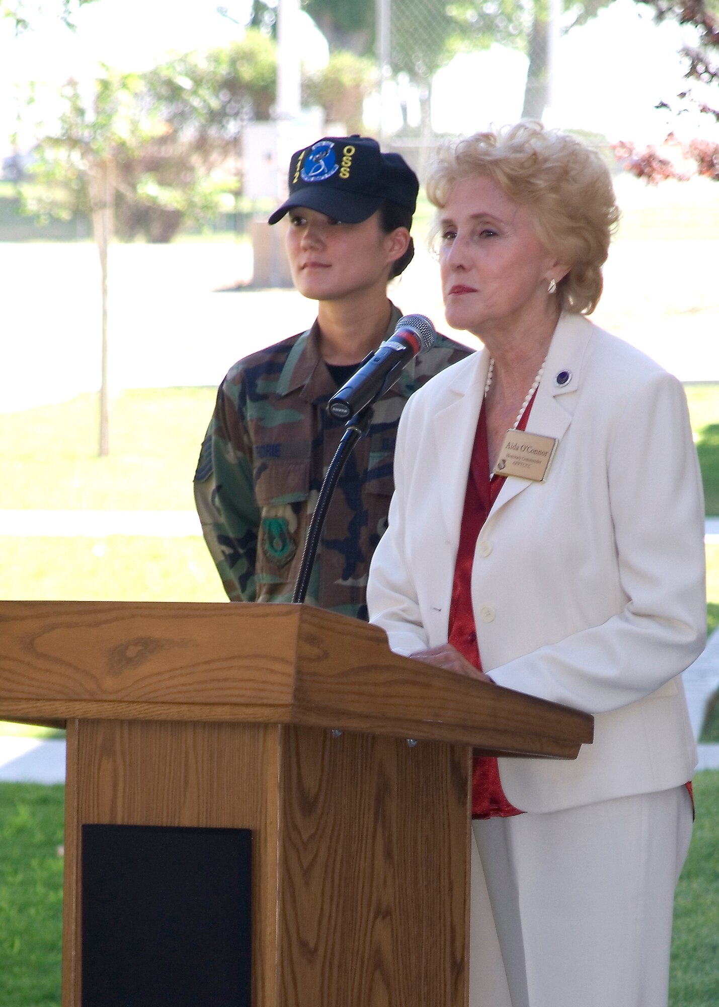 Aida O'Connor speaks to Team Edwards during the Higher Grounds Internet Cafe opening ceremony on base July 13. Mrs. O'Connor lead the Civilian Military Support Group in raising more than $30,000 for the project, which gave Airmen and Marines living in the dormitories a place to unwind. (Photo by Edward Cannon)