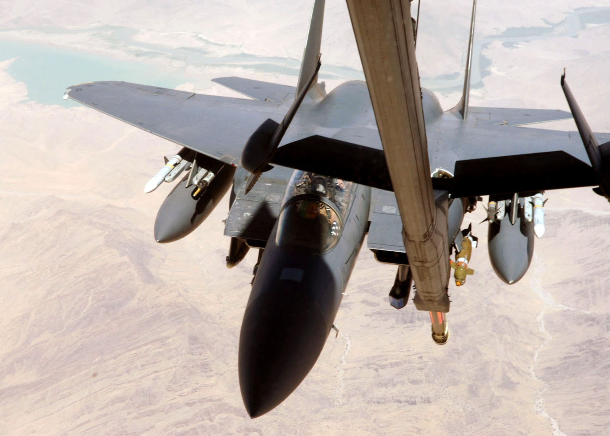 An F-15E Strike Eagle moves up to the refueling boom below a KC-10 Extender July 25 during an Operation Enduring Freedom mission.  Coalition tankers flew 45 sorties and off-loaded approximately 2.3 million pounds of fuel to 201 receiving aircraft. (U.S. Air Force photo/Airman 1st Class Matt Cook)