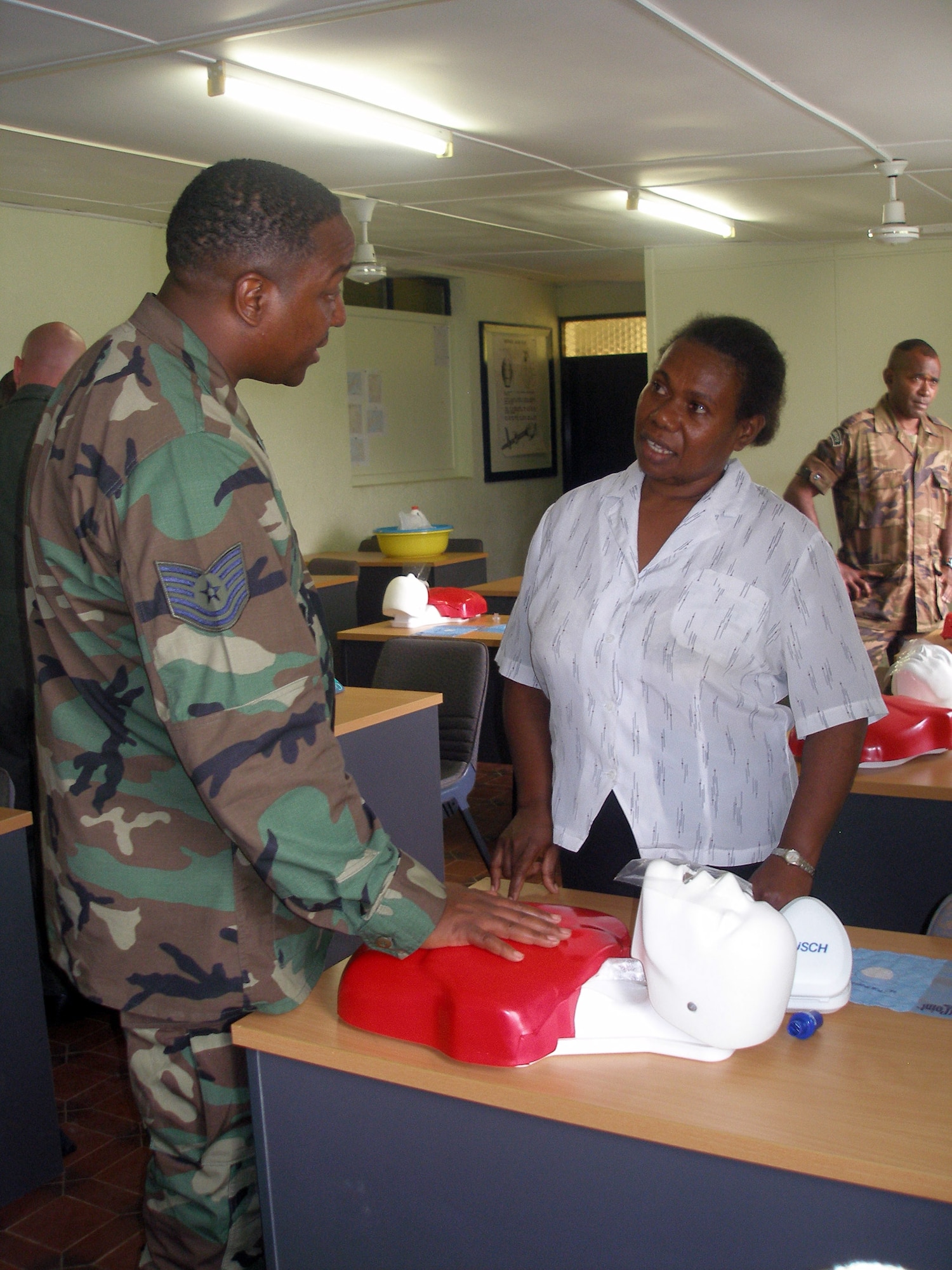 Tech. Sgt. William Parker gives basic life support instruction during a two-day  train-the-trainer class July 25 on Vanuatu. Sergeant Parker is the NCO in charge of Clinical Medicine Flight, 15th Medical Group from Hickam Air Force Base, Hawaii. He was part of a team that taught basic life support and self-aid buddy care train-the-trainer courses to police, immigration and customs personnel, and paramedics on the island of Vanuatu. The team was part of the Oceania Humanitarian Assistance Mission that brought medical, dental and engineering personnel to perform civil assistance projects on Vanuatu, Nauru and Kiribati July 20 through 30. (U.S. Air Force photo/Master Sgt. Bob Woods)