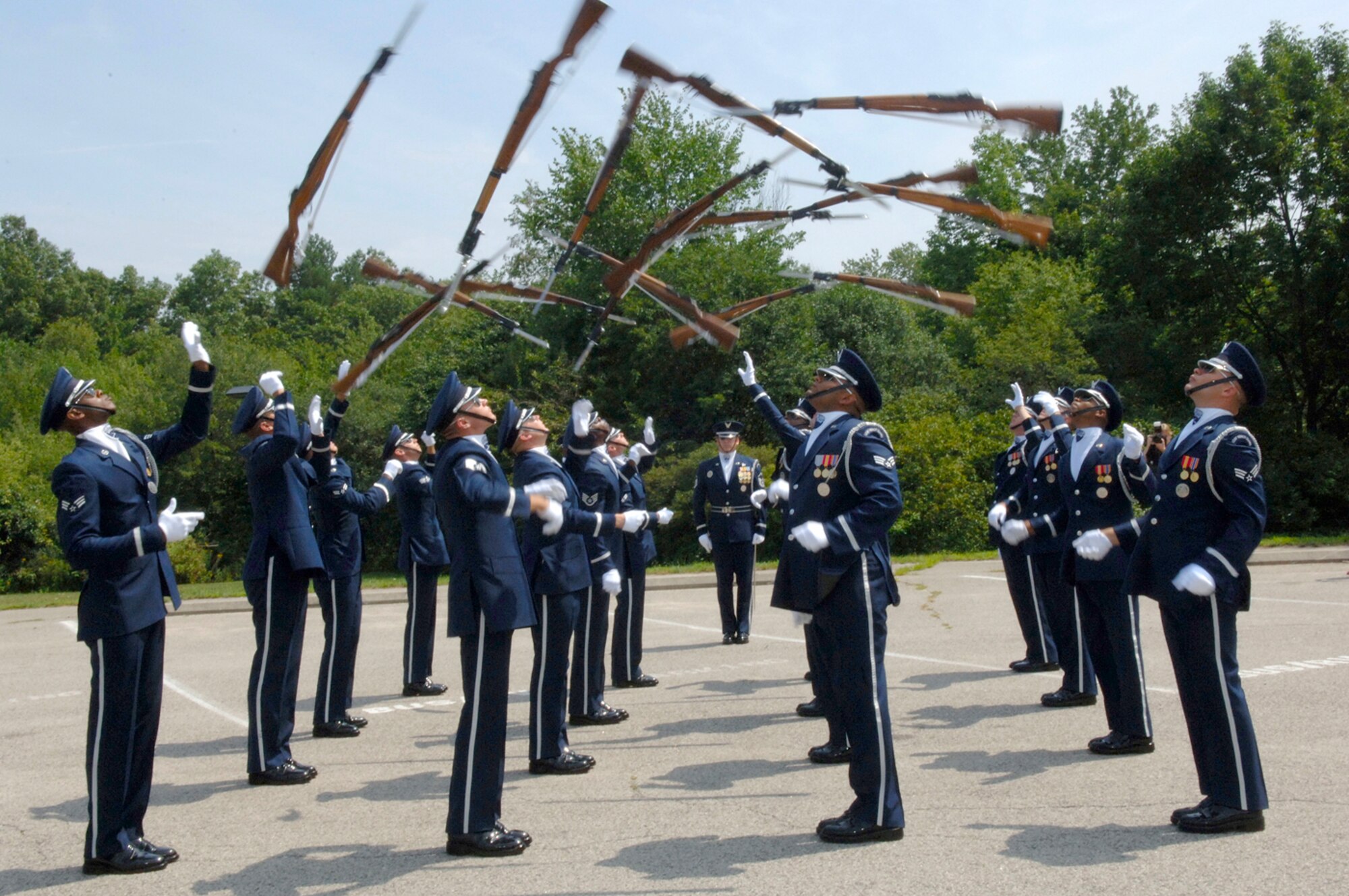HANSCOM AFB, Mass. -- The Air Force Honor Guard Drill Team performs in Minute Man National Historical Park in Lexington, Mass. Aug. 7. The Drill Team conducted two performance during their visit to Hanscom AFB. On Aug. 6 the Drill Team performed on base for the base populace; on Aug. 7 the Drill Team peformed for the public in the park. Both events were attended by approximately 100 people. (U.S. Air Force photo by Jan Abate)