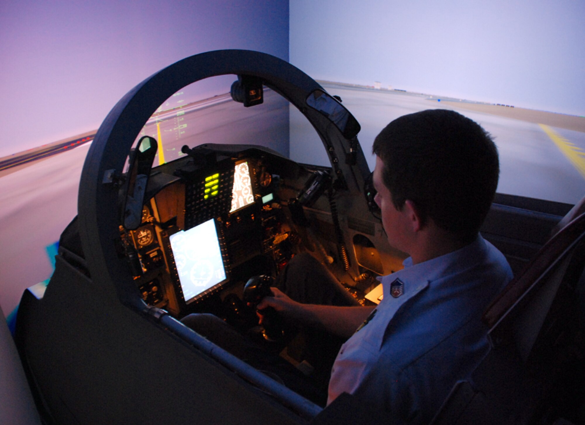 Cadet Master Sgt. Ryan Lowe, Plano Mustangs Composite Civil Air Patrol Squadron, tries out a T-38 simulator while tourning Sheppard with his CAP squadron July 25. (U.S. Air Force photo/Airman 1st Class Jacob Corbin)