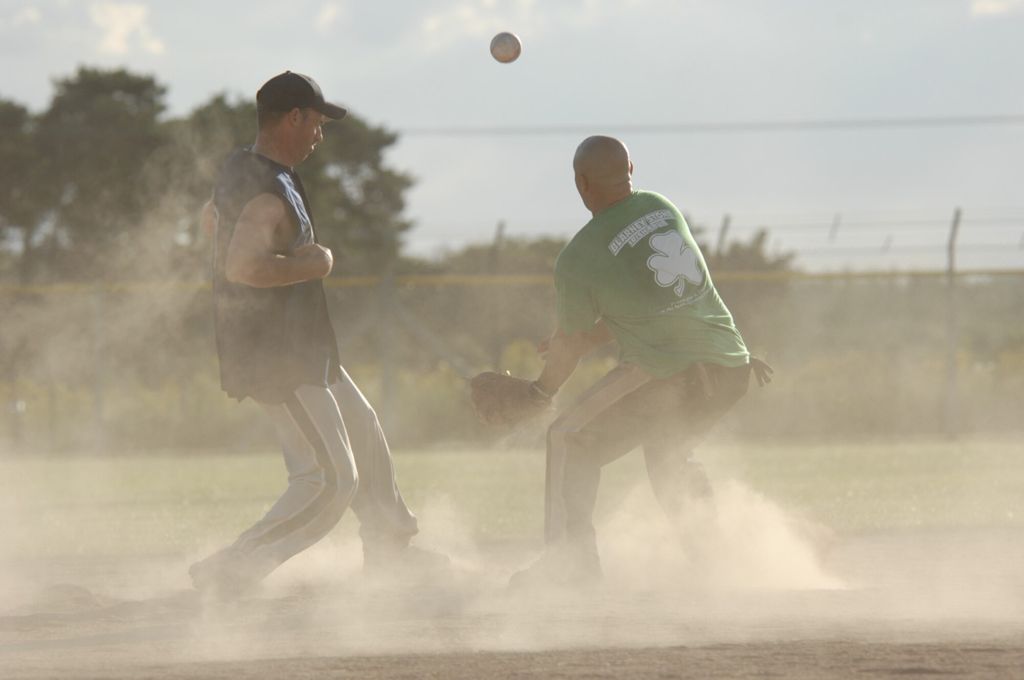 Shaun Elliott, 48th Civil Engineer Squadron, intramural softball team head coach, touches second base right before their opponents tag him out during the championship game Monday. Coach Elliott, along with his teammate and fellow 48th CES Airman, Chuck Hancuff are also members of the Lakenheath Eagles who will be representing the base at the U.S. Air Forces in Europe Softball Championship at Aviano AB, Italy. (U.S. Air Force photo by Airman 1st Class Jessica Snow)

