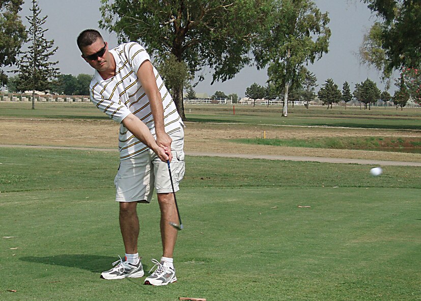 Master Sgt. Andrew Jones, 39 Air Base Wing Safety, chips one in for par at the Hodja Lakes Golf Course Aug. 1 in an intramural golf game. (U. S. Air Force photo by Tech. Sgt. Patrick R. Hyde)       