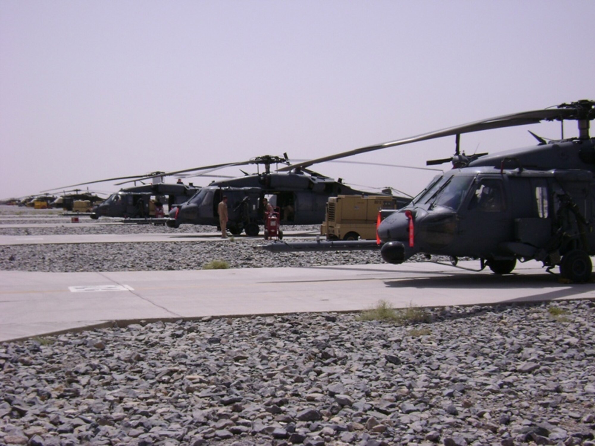Three 33rd Rescue Squadron HH-60 Pave Hawks await mission taskings at Kandahar, Afghanistan.  The 33rd RQS from Kadena Air Base, Japan, deployed the end of July to Kandahar to conduct combat search and rescue and medical rescue missions in support of Operation Enduring Freedom. The squadron headed back to Afghanistan after returning from a four-month deployment to Kandahar in May.  U.S. Air Force photo