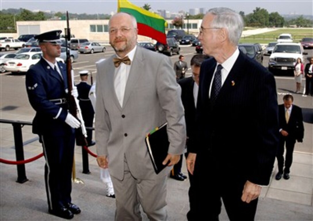 Lithuanian Minister of Defense Juozas Olekas (left) arrives at the Pentagon, Aug. 8, 2007, for security discussions with Deputy Defense Secretary Gordon England (right).  