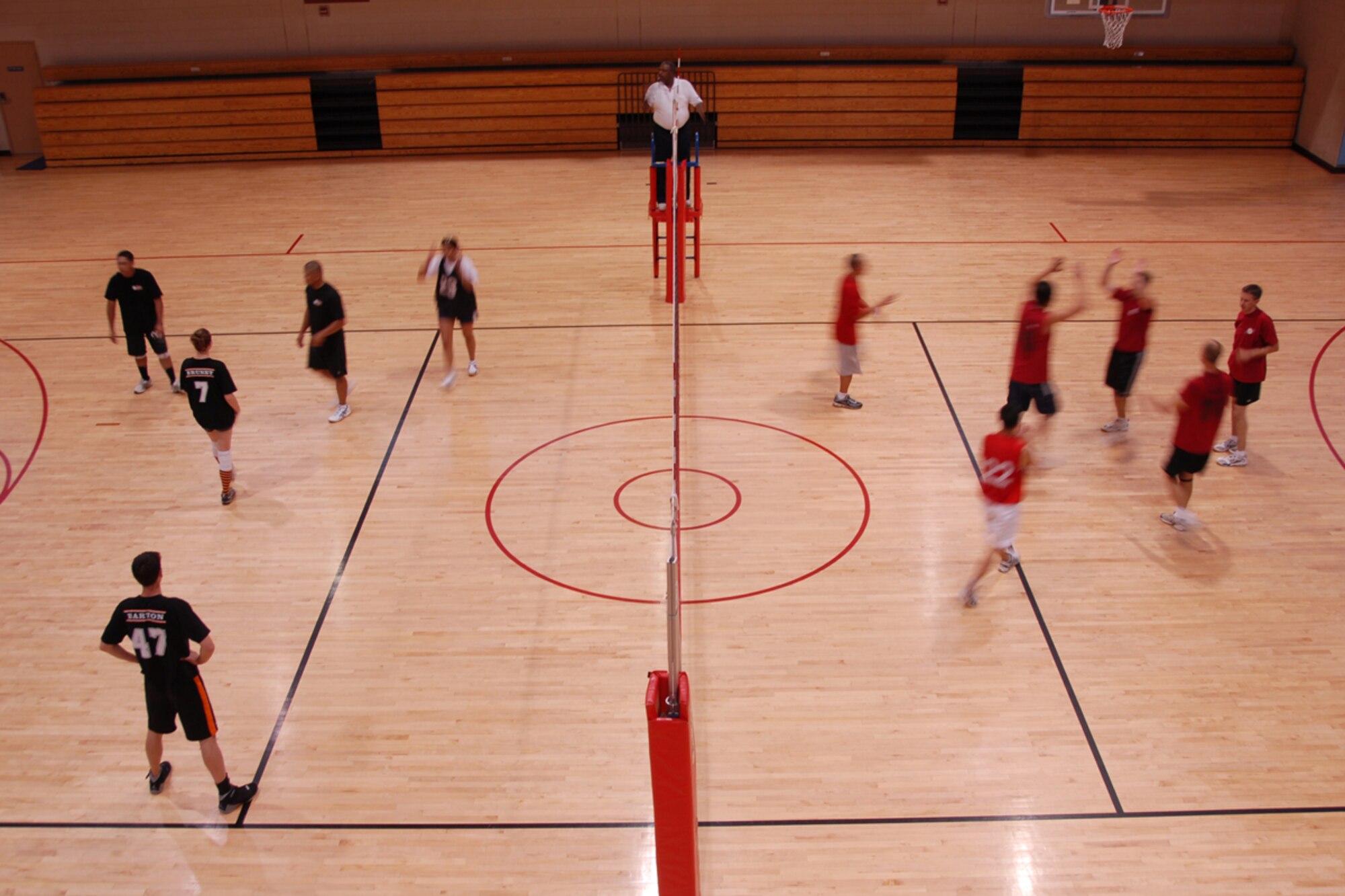 OSAN AIR BASE, Republic of Korea – Members of the 51st Medical Group volley ball team meet with members from the 303rd Intelligence Squadron team during the volleyball championship here on July 20.  The med group team was able to defeat the Intel team in two straight matches by a score of 25-15, 25-18 to take the championship.  (U.S. Air Force photo by Airman First Class Chad Strohmeyer)