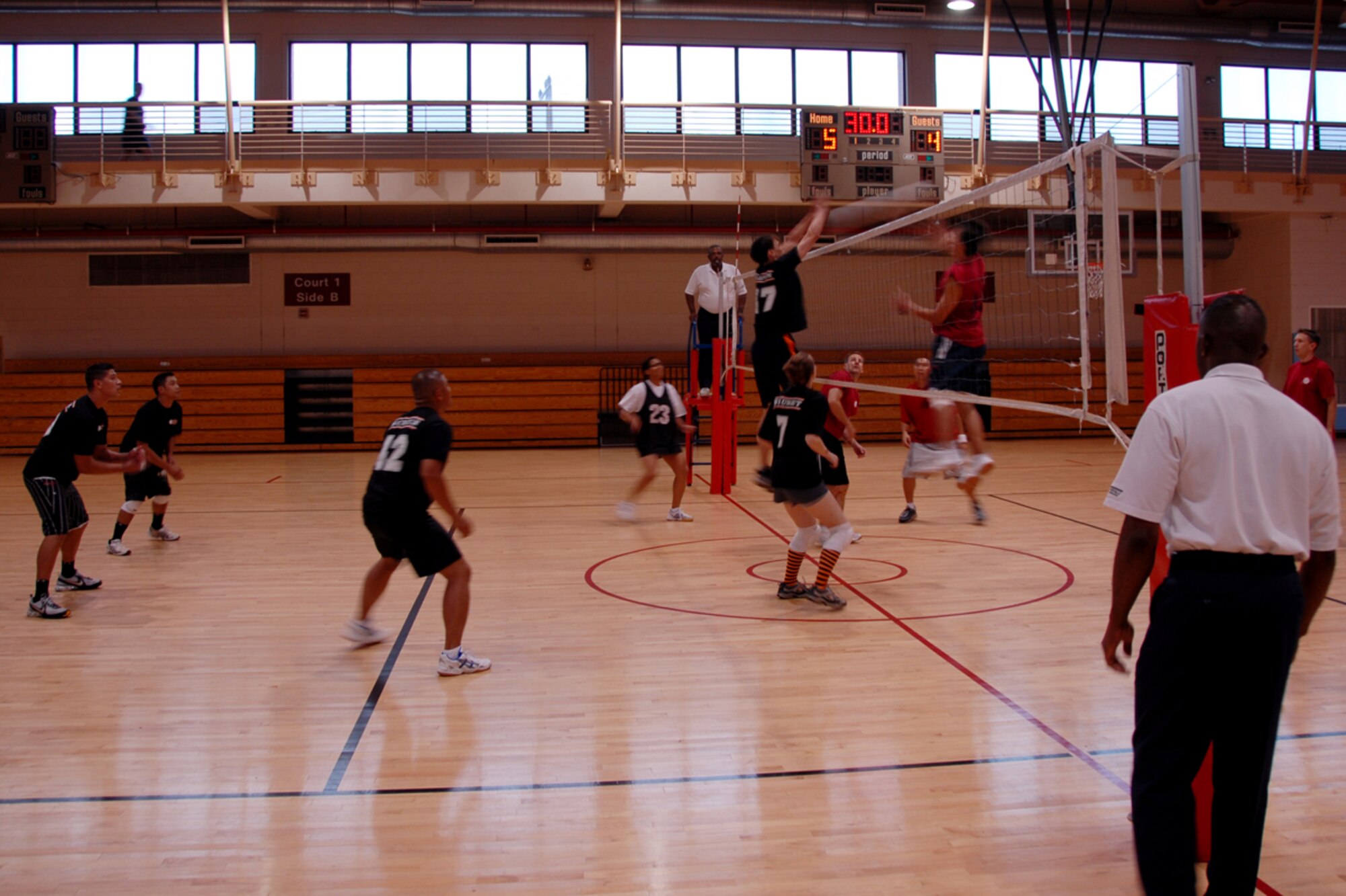 OSAN AIR BASE, Republic of Korea – Members of the 51st Medical Group volley ball team meet with members from the 303rd Intelligence Squadron team during the volleyball championship here on July 20.  The med group team was able to defeat the Intel team in two straight matches by a score of 25-15, 25-18 to take the championship.  (U.S. Air Force photo by Airman First Class Chad Strohmeyer)