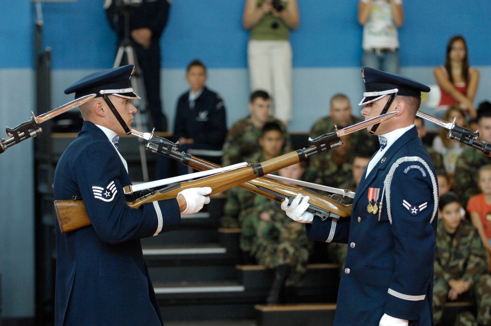 The U.S. Air Force Honor Guard Drill Team performs for AF members and families as well as Italian local nationals at Aviano Air Base, Italy on 30 July 2007.  During their Europe tour, the Drill Team will visit five major AF installations/events in three countries to recruit, retain and inspire while promoting and representing the Air Force internationally. (U.S. Air Force photo by Senior Airman Daniel DeCook)(Released)