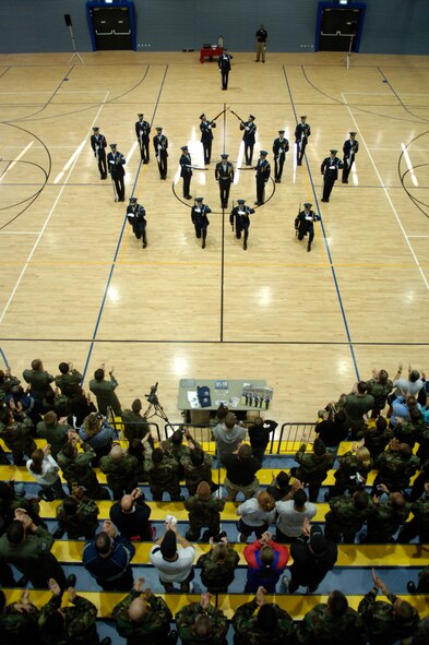 Warrior Airmen from Ramstein AB, Germany, give a standing ovation to the U.S. Air Force Honor Guard Drill Team at the conclusion of their performance on 1 Aug 2007.  During their Europe tour, the Drill Team will visit five major AF installations/events in three countries to recruit, retain and inspire while promoting and representing the Air Force internationally. (U.S. Air Force photo by Senior Airman Daniel DeCook)(Released)