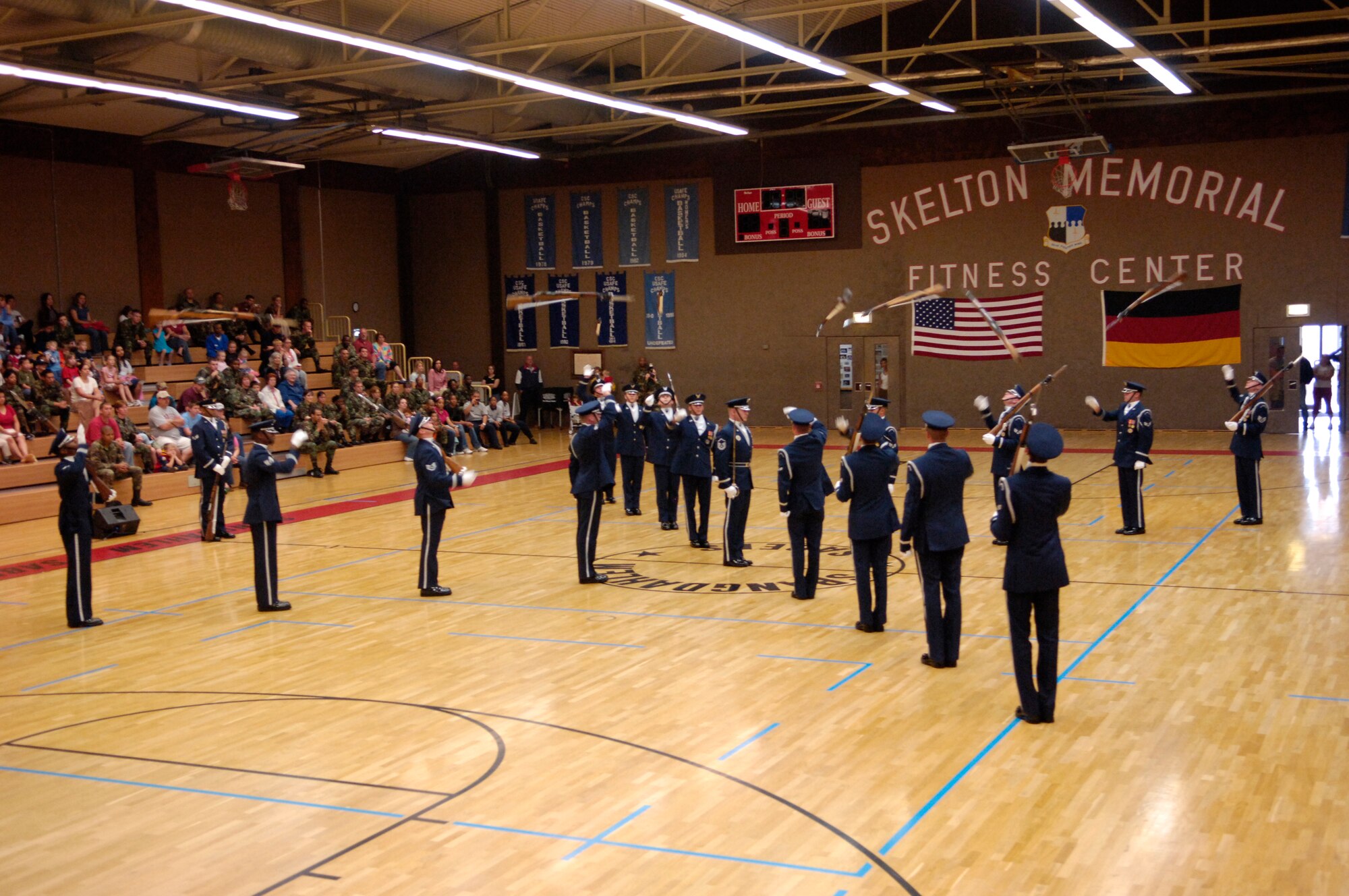Members of the U.S. Air Force Honor Guard Drill Team perform at the Skelton Memorial Fitness Center on Spangdahlem Air Base 2 Aug 2007.  During their Europe tour, the Drill Team will visit five major AF installations/events in three countries to recruit, retain and inspire while promoting and representing the Air Force internationally. (U.S. Air Force photo by Senior Airman Daniel DeCook)(Released)