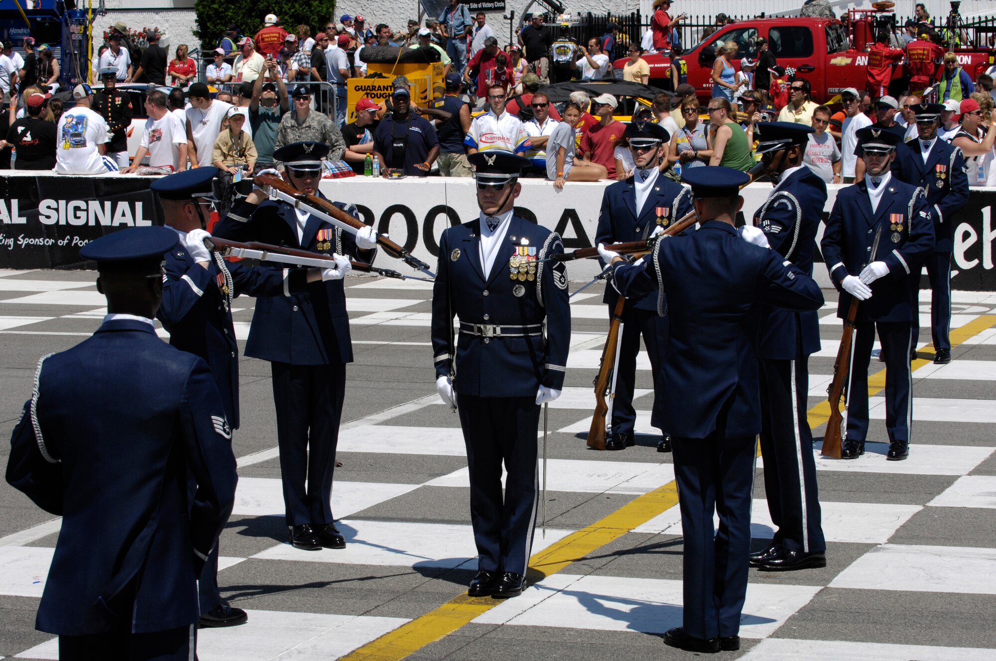 The United States Air Force Honor Guard Drill Team performs at the Pocono Motor Raceway in Pocono, PA, Aug. 5, 2007.  Pocono Motor Raceway is the first stop for the Drill Team on their Northeast Tour to promote the Air Force mission, showcasing drill performances at public and military venues to recruit, retain, and inspire Airmen. (U.S. Air Force photo by Airman First Class Marleah Miller)(Released)