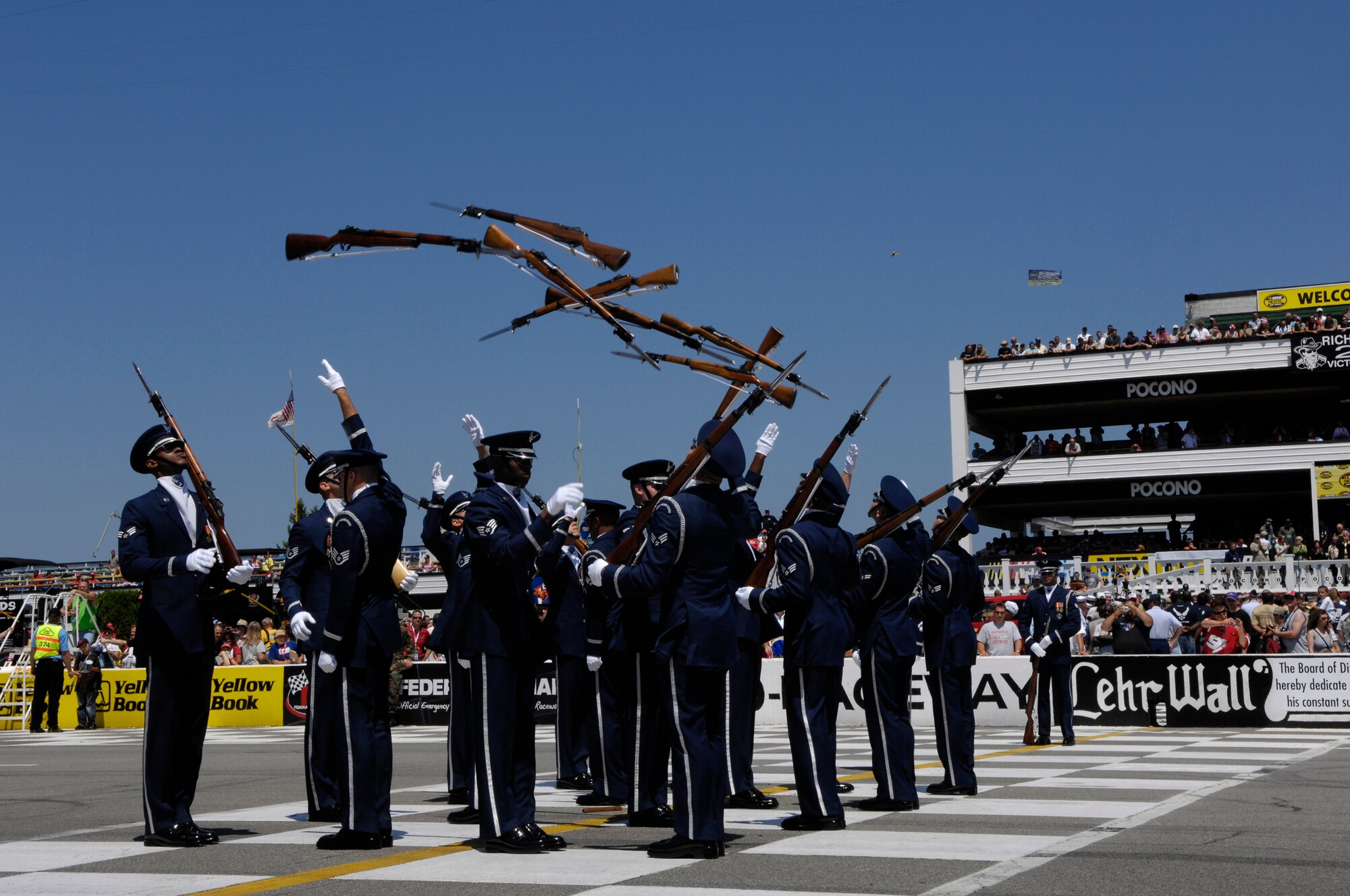 The United States Air Force Honor Guard Drill Team performs at the Pocono Motor Raceway in Pocono, PA, Aug. 5, 2007.  Pocono Motor Raceway is the first stop for the Drill Team on their Northeast Tour to promote the Air Force mission, showcasing drill performances at public and military venues to recruit, retain, and inspire Airmen. (U.S. Air Force photo by Airman First Class Marleah Miller)(Released)
