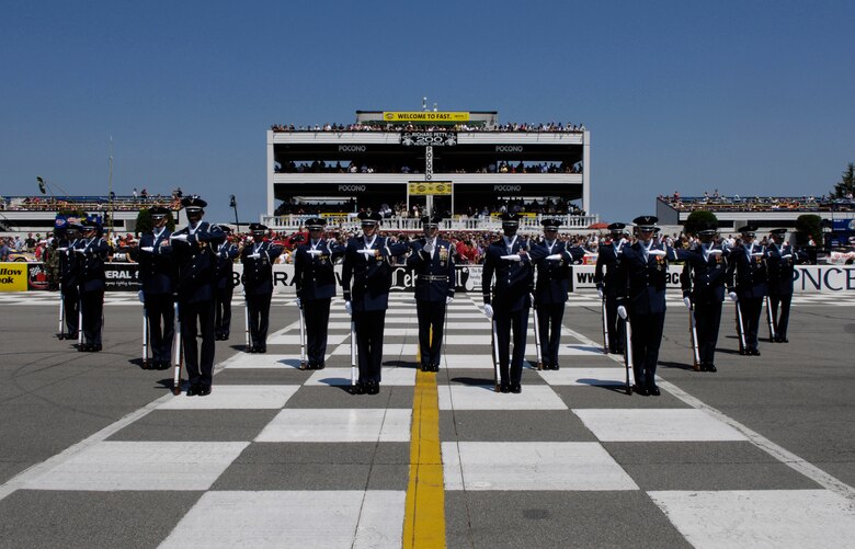 The United States Air Force Honor Guard Drill Team performs at the Pocono Motor Raceway in Pocono, PA, Aug. 5, 2007.  Pocono Motor Raceway is the first stop for the Drill Team on their Northeast Tour to promote the Air Force mission, showcasing drill performances at public and military venues to recruit, retain, and inspire Airmen. (U.S. Air Force photo by Airman First Class Marleah Miller)(Released)