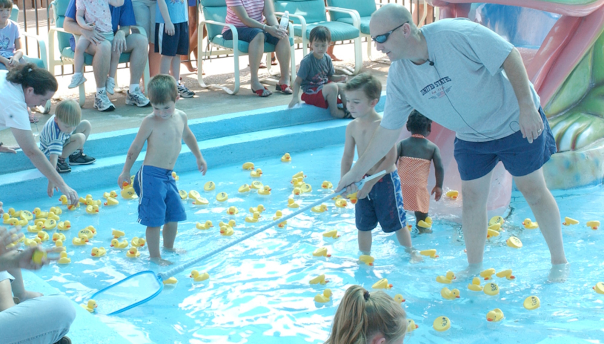Col. David Allvin, 97th Air Mobility Wing commander, nets a winning duckling in Saturday’s Duck Derby fund raiser for the Altus AFB Youth Center. (U.S. Air Force photo/Michael Fletcher)