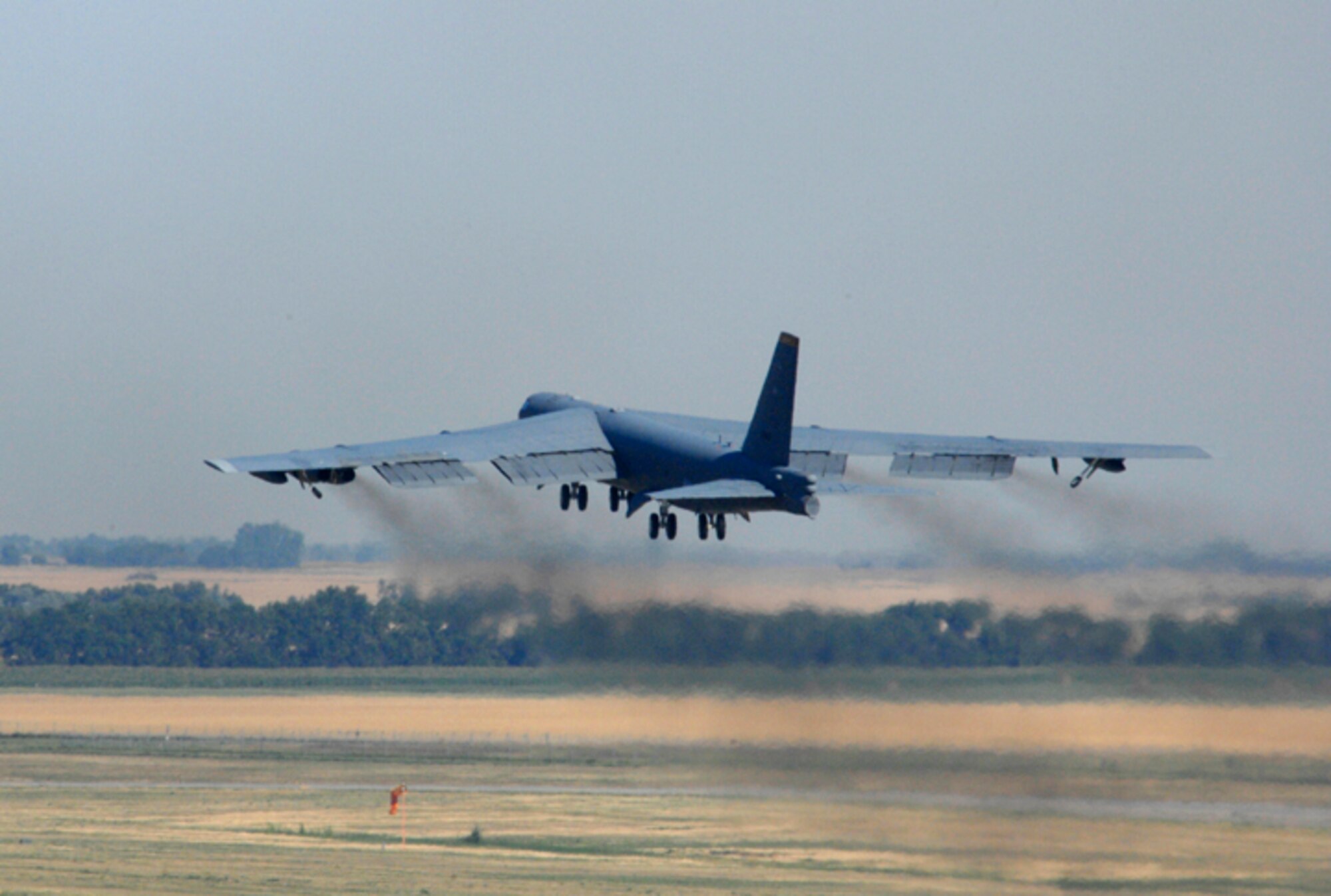 MINOT AIR FORCE BASE, N.D. -- A B-52H Stratofortress takes off from here during a eight-ship rapid-launch generation exercise on Aug. 9. Generation exercises test the base's ability to perform its mission. 

The B-52 is a long-range, heavy bomber that can perform a variety of missions. It is capable of flying at high subsonic speeds at altitudes up to 50,000 feet (15,166.6 meters). It can carry nuclear or precision guided conventional ordnance with worldwide precision navigation capability. (U.S. Air Force photo by Senior Airman Christopher Boitz)