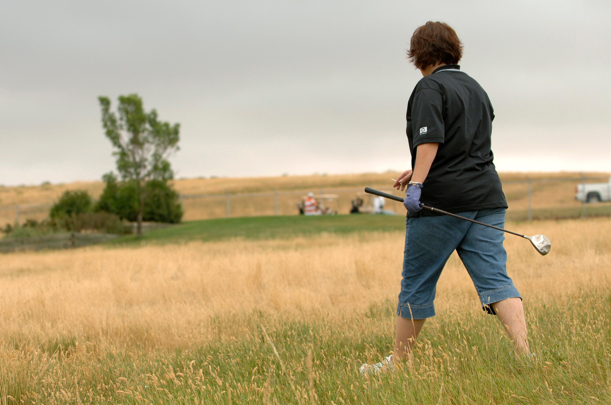U.S. Air Force Major Debra Jackson, 28th Communications Squadron Commander, searches for her ball during the 28th Bomb Wing First Sergeants Association annual golf tournament at Ellsworth Air Force Base, S.D., Aug. 3, 2007.  The tournament raised $1,700 which will be used for various Ellsworth enlisted functions, awards, and charities.  (U.S. Air Force photo by SSgt Michael B. Keller)(Released)