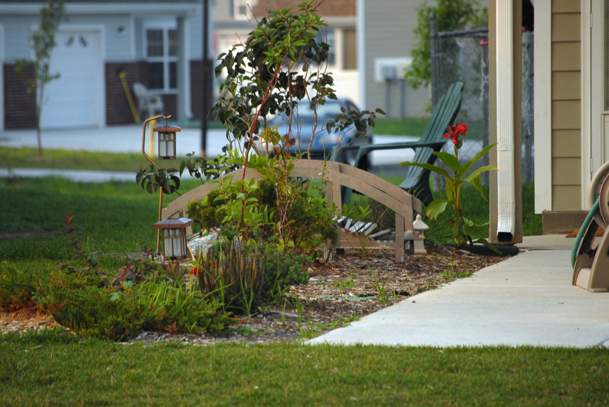 This yard stands out on the Eagle Heights 'main drag' for its elaborate landscaping and wooden bridge. The yard is maintained by residents Staff Sgt. Alexander Patosa and his wife Deborah. (U.S. Air Force photo/Tech Sgt. Kevin Wallace)