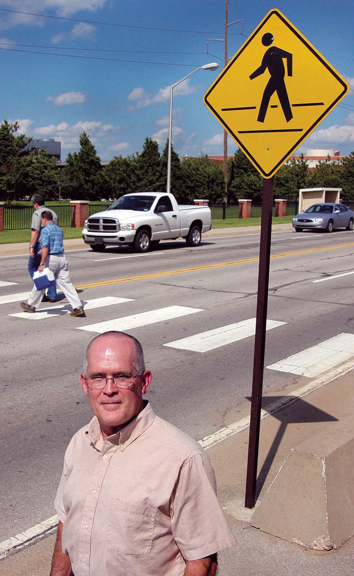Heavy traffic and lots of pedestrians used to be a recipe for danger; something worker Lewis Haddock knew needed changing. His focus on the problem and suggestions led base officials to name him the first Safety Hero. Better signs, lighting and channeling of pedestrian traffic are some changes making the area safer. (Air Force photo by Margo Wright)
