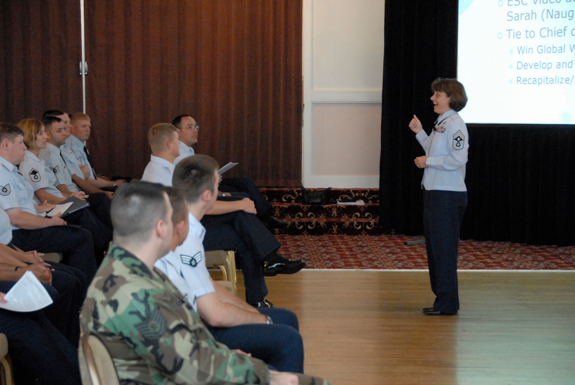 66th Air Base Wing and Electronic Systems Center Command Chief Master Sgt. Lisa Sirois, right, informs Hanscom's enlisted population about current Air Force hot topics during an enlisted call at the Minuteman Club July 31. (U.S. Air Force photo by Senior Airman Clinton Atkins.)