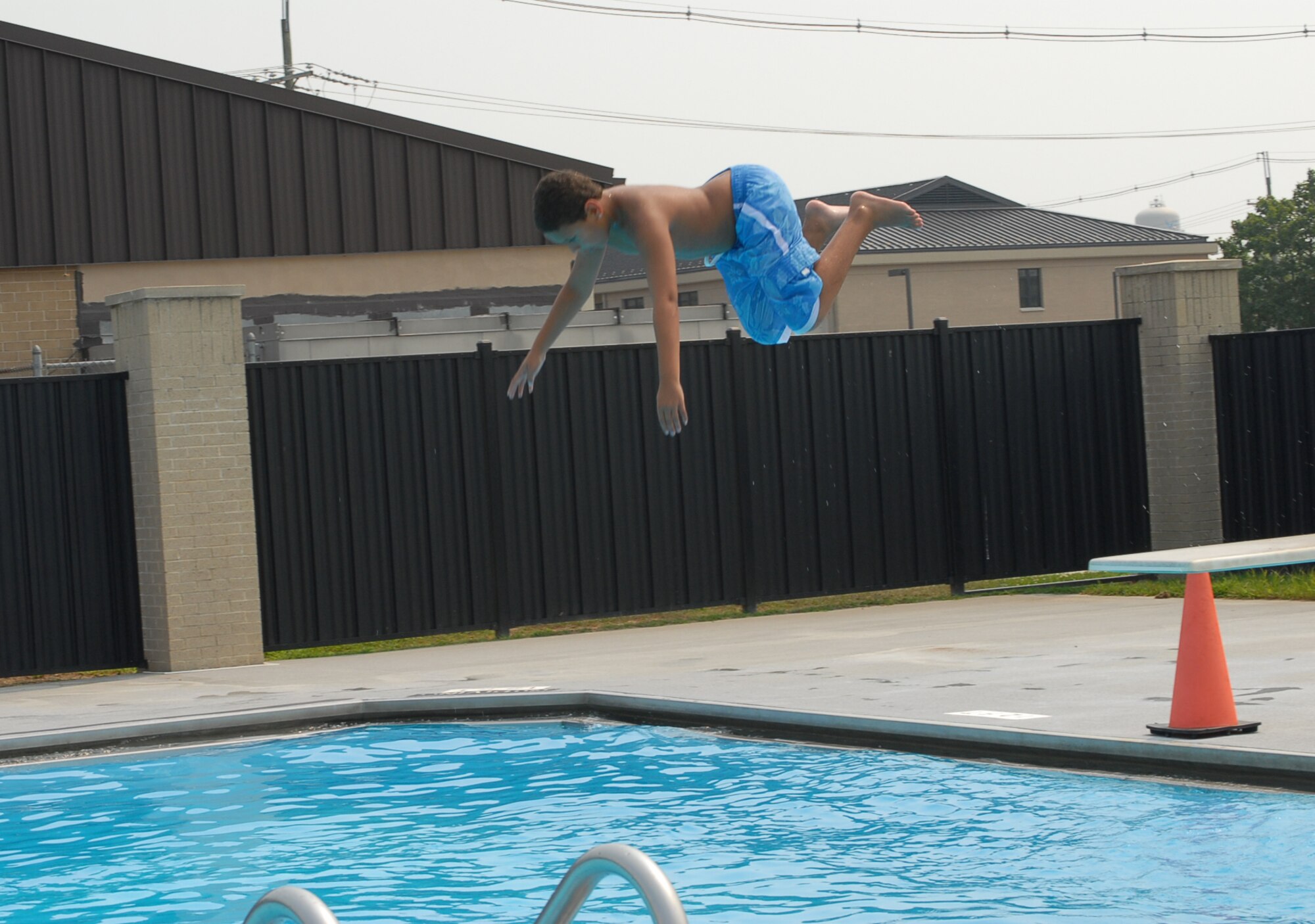 Damian Tolson, 10 years old, executes a dive at Dover Air Force Base's Eagle Oasis Pool during the first sergeants’ family pool party here Saturday. (U.S. Air Force photo/Tech. Sgt. Kevin Wallace)