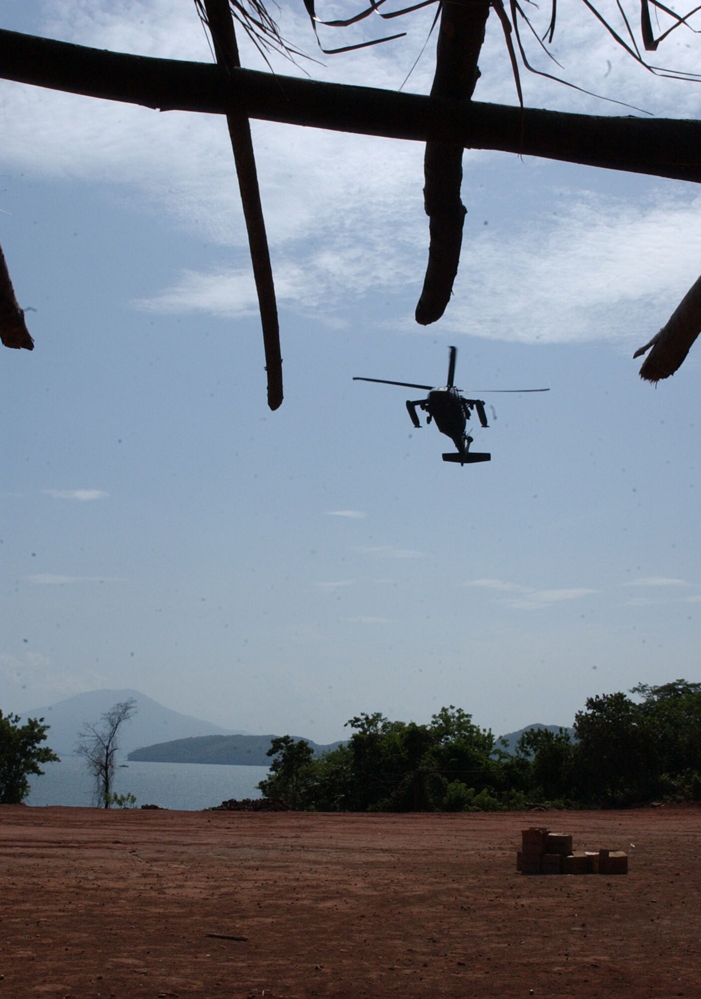 A UH-60 Black Hawk from the 1st Battalion, 228th Aviation Regiment prepares to land in a soccer field in Coyolito, Honduras to pick up humanitarian supplies for Project Handclasp. Project Handclasp is a partnership between the Navy and corporations, public service organizations, non-government organizations and individuals throughout the United States to provide humanitarian assistance overseas. Members of Joint Task Force-Bravo, at Soto Cano Air Base, provided air, ground and logistical support for the mission. Air Force photo by Senior Airman Shaun Emery.                                                            