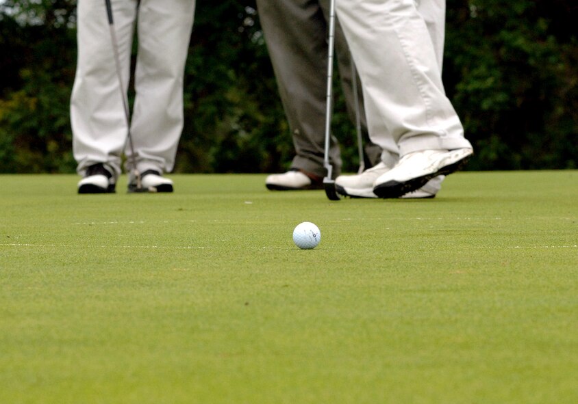 GRAND FORKS AIR FORCE BASE, N.D. --  A lone golf ball awaits its future during the annual Grand Forks Military Appreciation Committee golf tournament. Teams comprised of both military and civilian leaders, spent the morning of Aug. 6 in friendly competition including longest drive, longest putt and closest to the hole contests. (U.S. Air Force photo/Senior Airman SerMae Lampkin)