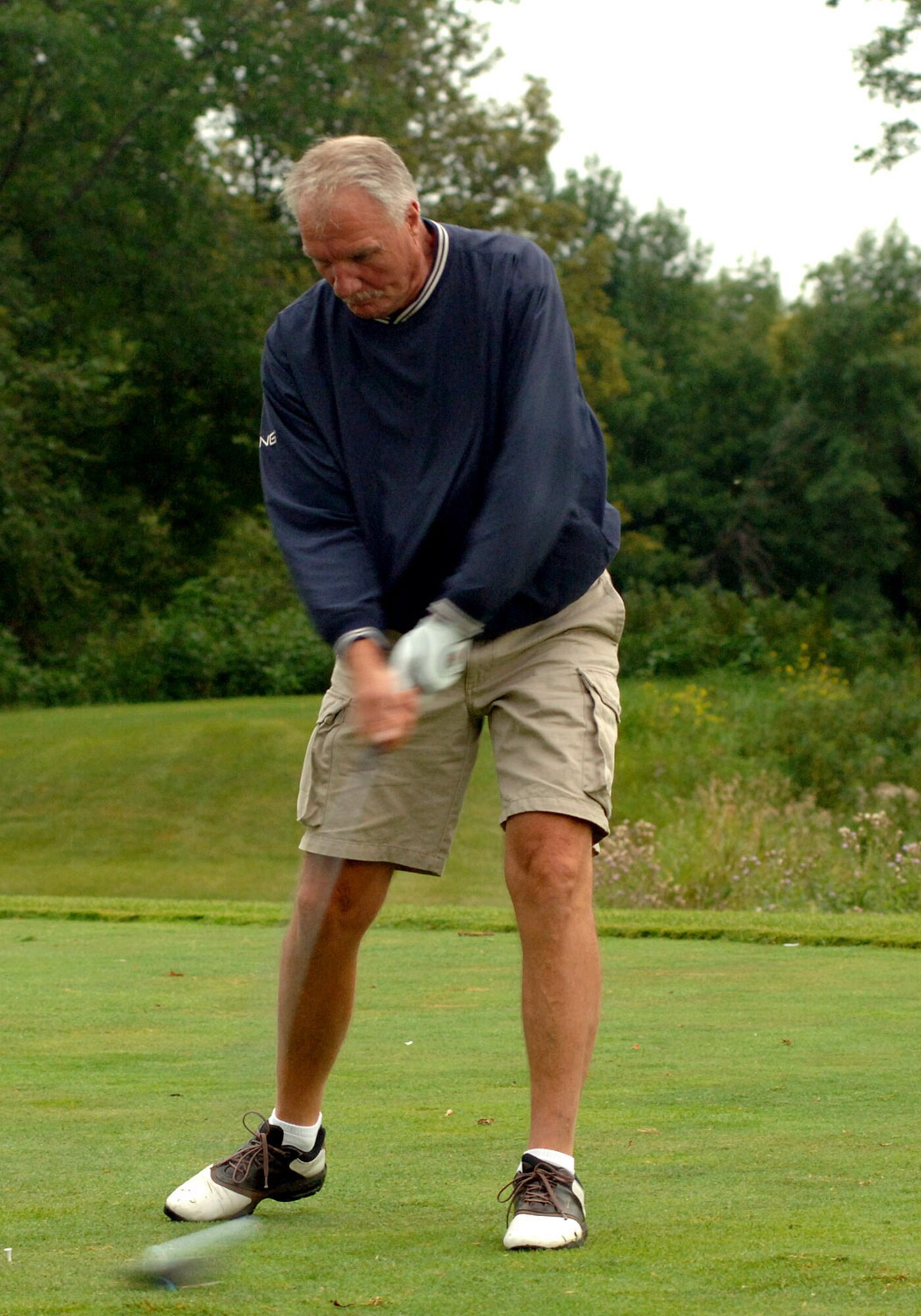 GRAND FORKS AIR FORCE BASE, N.D. -- Mr. Jerry Hasbrouck, 319th Maintenance Operations Squadron honorary commander, chips his golf ball onto the green the annual Grand Forks Military Appreciation Committee golf tournament. Teams comprised of both military and civilian leaders, spent the morning of Aug. 6 in friendly competition including longest drive, longest putt and closest to the hole contests. (U.S. Air Force photo/Senior Airman SerMae Lampkin)