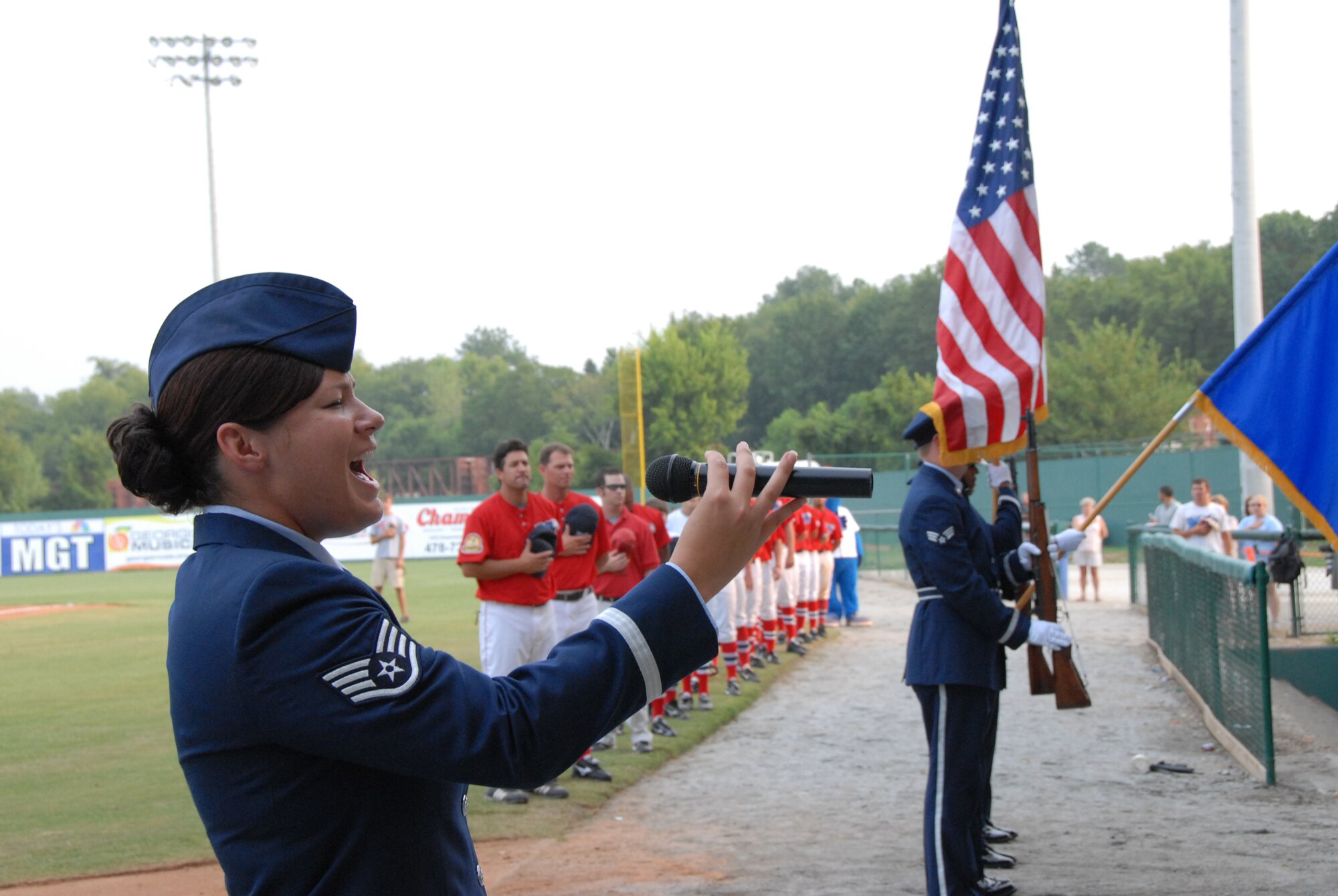 SSgt. Frances Hudlow, Band of the United States Air Force Reserve, sings the national anthem during pre-game ceremonies at Military Night at the Macon Music game. U. S. Air Force photo by Sue Sapp