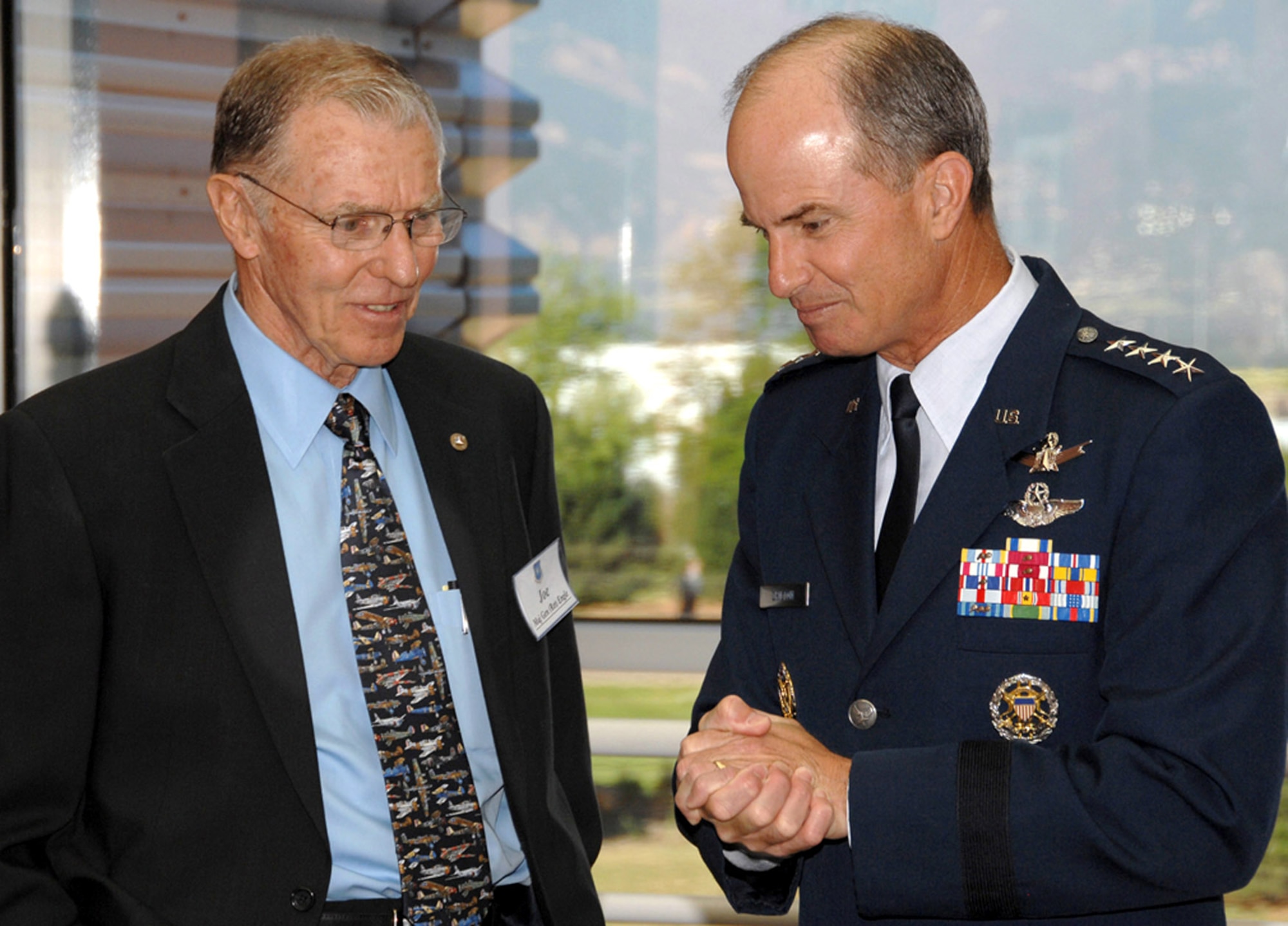 Gen. Kevin P. Chilton meets with retired Maj. Gen. Joe Engle before the Air Force Space and Missile Pioneers Hall of Fame induction ceremony Aug. 8 at Peterson Air Force Base, Colo. General Engle, who flew the X-15 experimental aircraft into space in 1965, and former Chief of Staff of the Air Force retired Gen. Lew Allen Jr. were honored for their contributions to Air Force space and missile programs. General Chilton is the commander of Air Force Space Command. (U.S. Air Force photo/Tech. Sgt. Raheem Moore)