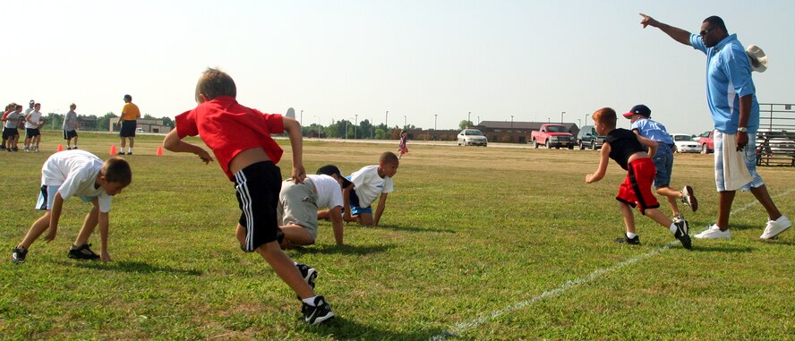 WHITEMAN AIR FORCE BASE, Mo. - Neil Smith supervises children drilling during the Aug. 8 youth football clinic at the base soccer field. He made the Pro Bowl 6 times during his career and led the National Football League with 15 sacks in the 1993 season. (U.S. Air Force photo/Airman 1st Class Stephen Linch)
