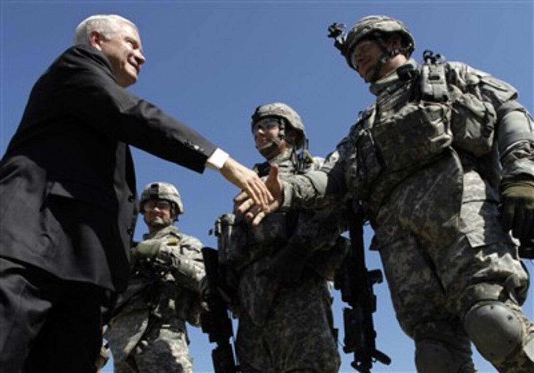 Defense Secretary Robert M. Gates meets with trainees who are preparing to deploy during a tour of the transition team training facility at Camp Funston, Fort Riley, Kan., Aug. 9, 2007.  