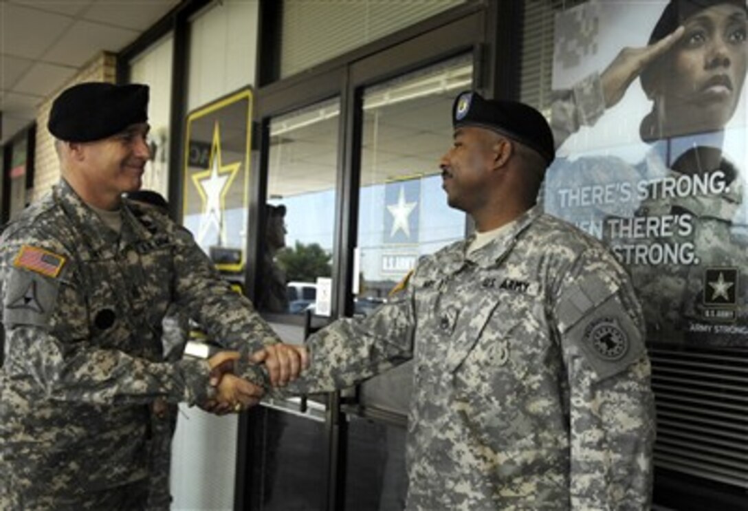 U.S. Army Command Sgt. Maj. William J. Gainey (left), senior enlisted advisor to the chairman of the Joint Chiefs of Staff, meets with an Army recruiter during a visit to the East Wichita, Kan., Recruiting Station, Aug. 9, 2007.  
 