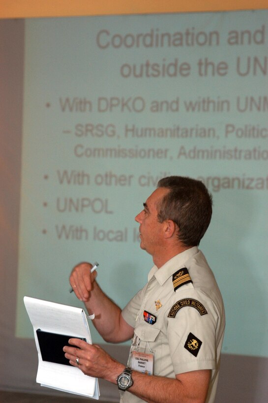 ULAANBAATAR, Mongolia - French Col. Philippe Bardet briefs a portion of the after-action review at the conclusion of a command post exercise here Aug. 10. The CPX was part of exercise Khaan Quest 07 and brought officers from 19 countries together in a simulated United Nations force headquarters which aimed to improve Global Peace Operations Initiative Peace Support Operations core competencies, enhance multinational interoperability, enhance military-to-military relationships, and improve teamwork and multinational cooperation. (Official U. S. Marine Corps photo by Sgt. G. S. Thomas)