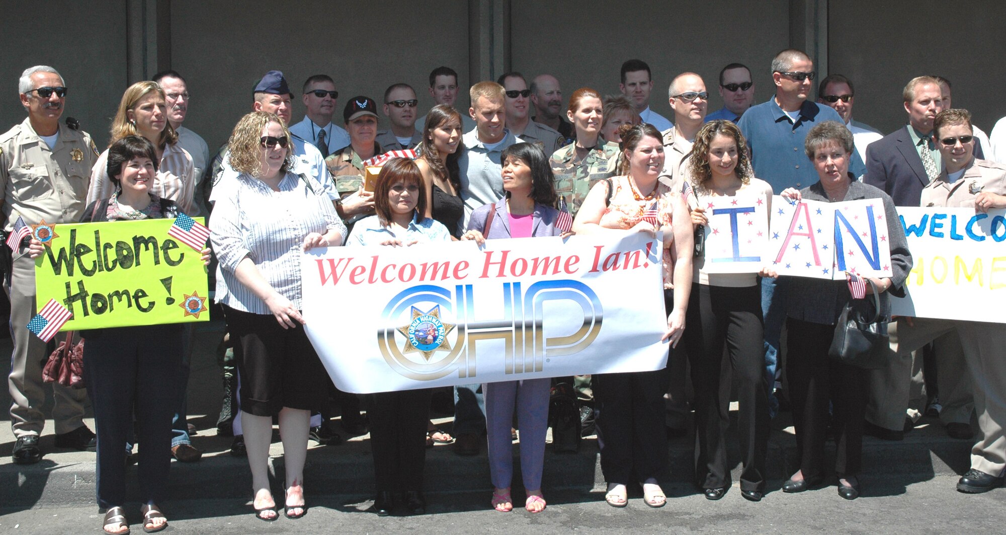 A group of California Highway Patrol officers, family, and friends gathered Aug 9 at Sacramento International Airport to welcome home four Reservists from the 940th Logistics Readiness Squadron. The four Airmen were deployed for six months to Manas Air Base, Kyrgyzstan in support of the Global War on Terror. This was the second deployment for all of them. Master Sgt. Ian Troxell, who works internal affairs for the CHP, received a bronze star and the Purple Heart on his first deployment. (US Air Force photo/Master Sgt Ellen L Hatfield)