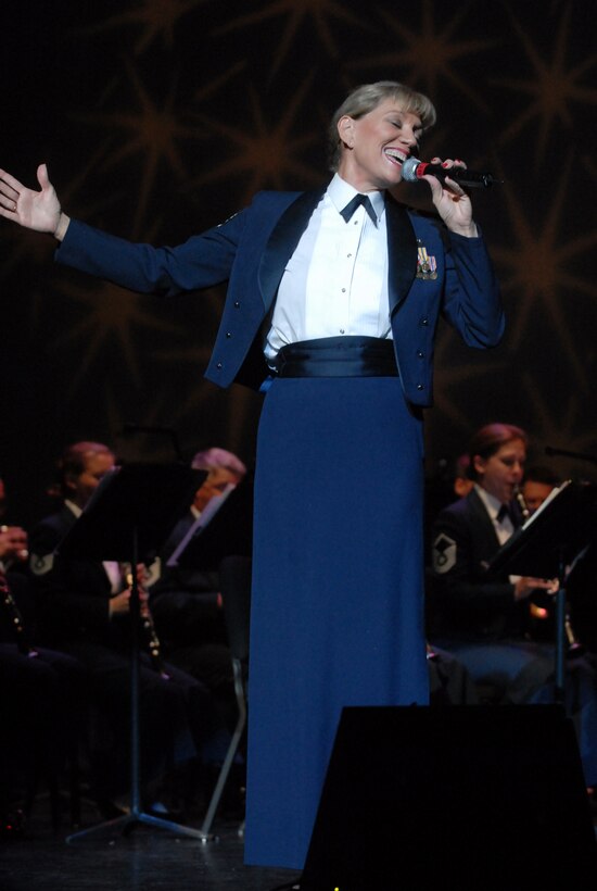 CMSgt Marcelle Hureau sings with the concert band