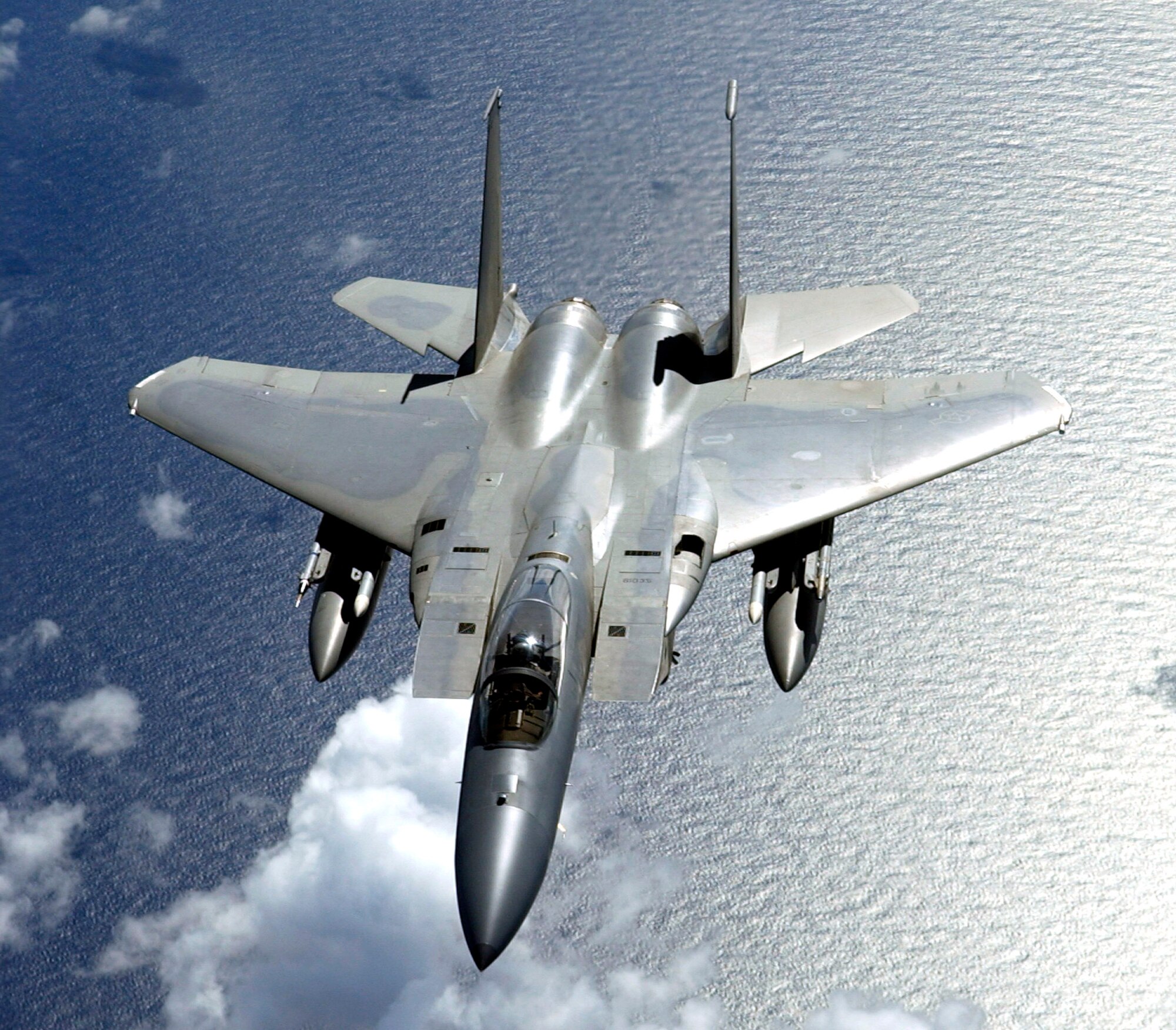 An F-15 Eagle flies over the Pacific during Valiant Shield Aug. 9. The F-15 is from the 44th Fighter Squadron at Kadena Air Base, Japan. During the exercise, Air Force aircraft and Airmen from stateside bases and Kadena AB will comprise part of an expeditionary air wing based at Andersen Air Force Base, Guam. These forces will participate in integrated joint training with Navy and Coast Guard forces. (U.S. Air Force photo/Senior Airman Miranda Moorer) 
