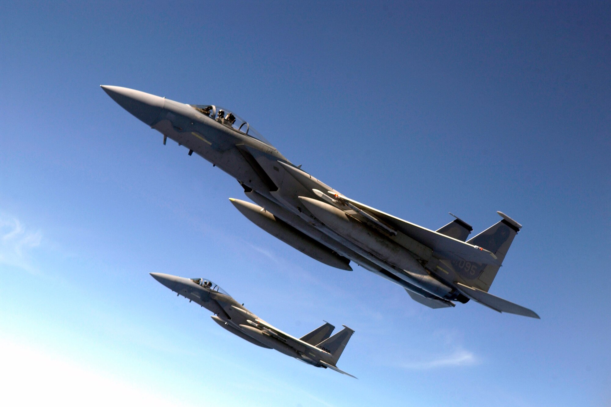 F-15 Eagles fly over the Pacific during Valiant Shield Aug. 9. The F-15s are from the 44th Fighter Squadron at Kadena Air Base, Japan. During the exercise, Air Force aircraft and Airmen from stateside bases and Kadena AB will comprise part of an expeditionary air wing based at Andersen Air Force Base, Guam. These forces will participate in integrated joint training with Navy and Coast Guard forces. (U.S. Air Force photo/Senior Airman Miranda Moorer) 
          