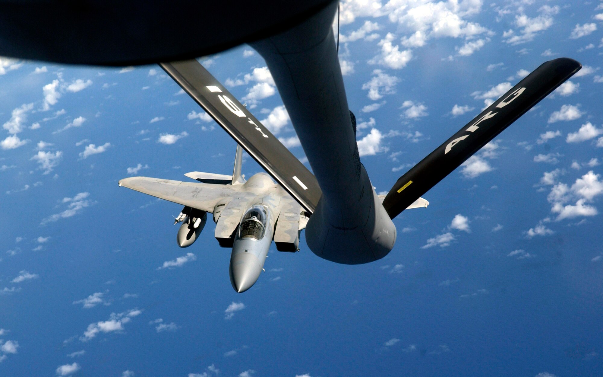 An F-15 Eagle flies toward the boom of a KC-135 Stratotanker during Exercise Valiant Shield Aug. 9 at Andersen Air Force Base, Guam. The F-15 is from the 44th Fighter Squadron at Kadena Air Base, Japan, and the KC-135 is from the New Hampshire Air National Guard. During the exercise, Air Force aircraft and Airmen from stateside bases and Kadena AB will comprise part of an expeditionary air wing based at Andersen AFB. Andersen AFB will also be the bed-down location for approximately 64 Air Force and 29 Navy aircraft, plus transient aircraft, during Valiant Shield. (U.S. Air Force photo/Senior Airman Miranda Moorer) 
