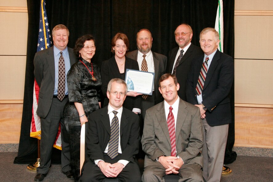 Arnold Engineering Development Center's Robert Howard, standing, second from the right, was on the team that received the 2007 Climate Protection Award from the U.S. Environmental Protection Agency. Other team members were Steven Hartle (Naval Air Systems Command), Curtis Kimbel (Naval Air Systems Command), John Kinsey (U.S. Environmental Protection Agency), Richard Miake-Lye (Aerodyne Research), Phillip Whitefield (University of Missouri at Rolla), Chowen Wey (NASA), and Wayne Miller (University of California-Riverside). The work conducted at AEDC was accomplished through the Technology and Analysis program. (Photo provided) 

