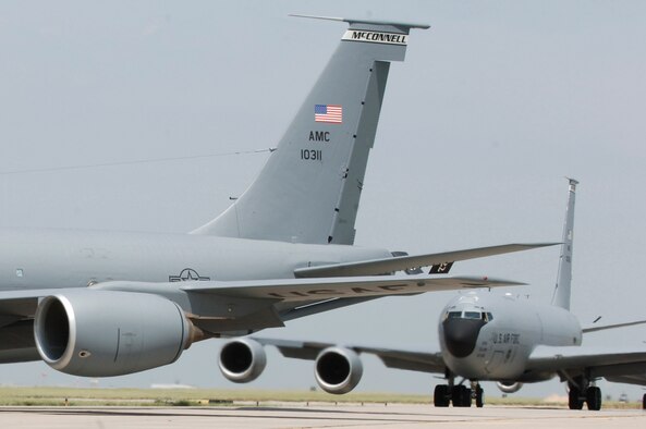 MCCONNELL AIR FORCE BASE, Kan. -- McConnell KC-135 Stratotankers turn on to a taxiway to form an "elephant walk" formation here Aug. 5 during a generation exercise. The exercise showcased McConnell aircrews’ capability to prepare a flight and take off within minutes of being notified of a mission. These types of exercises are conducted randomly each year. (Photo by Airman Justin Shelton)