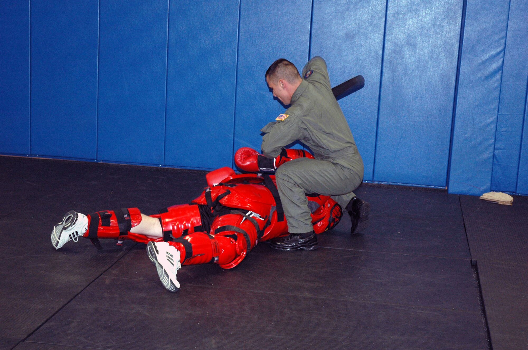 Staff Sgt. John Hoffecker, Phoenix Raven training instructor, participates with a fellow instructor wearing a "Red Man" suit in a demonstration of a "hostile situation" that is used to train Raven students in the program Aug. 3, 2007, at the U.S. Air Force Expedtionary Center on Fort Dix, N.J.  Raven training is conducted by the Center's 421st Combat Training Squadron.  (U.S. Air Force Photo/Tech. Sgt. Scott T. Sturkol)