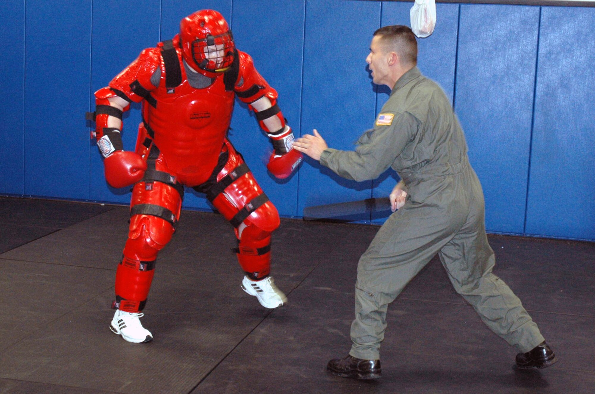 U.S. Air Force Staff Sgt. John Hoffecker, Phoenix Raven training instructor, participates with a fellow instructor wearing a "Red Man" suit in a demonstration of a "hostile situation" that is used to train Raven students in the program Aug. 3, 2007, at the U.S. Air Force Expedtionary Center on Fort Dix, N.J.  Raven training is conducted by the Center's 421st Combat Training Squadron.  (U.S. Air Force Photo by Tech. Sgt. Scott T. Sturkol)