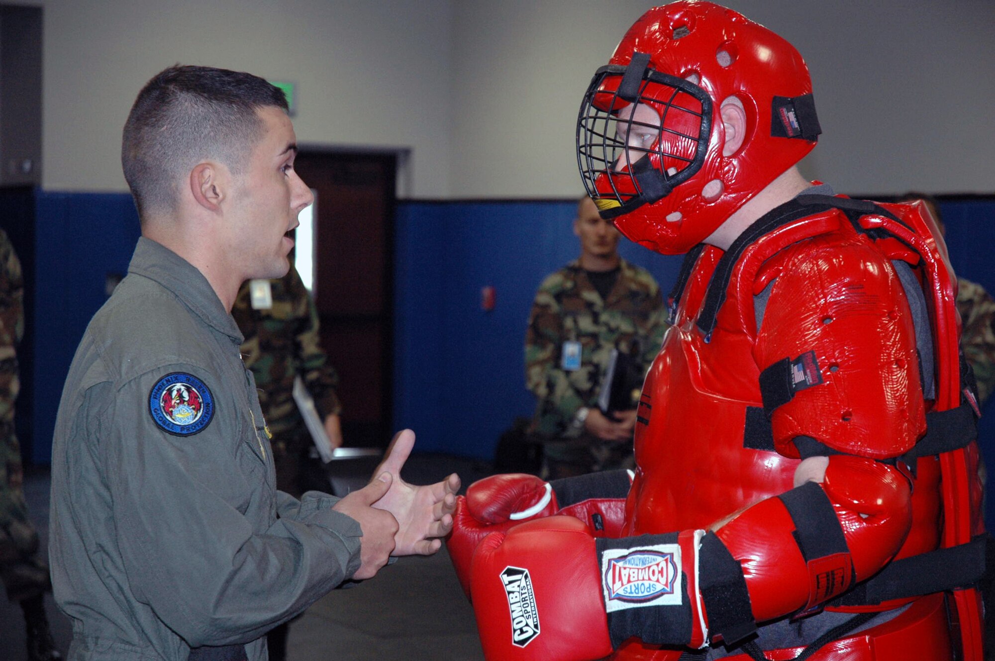 U.S. Air Force Staff Sgt. John Hoffecker, Phoenix Raven training instructor, participates with a fellow instructor wearing a "Red Man" suit in a demonstration of a "hostile situation" that is used to train Raven students in the program Aug. 3, 2007, at the U.S. Air Force Expedtionary Center on Fort Dix, N.J.  Raven training is conducted by the Center's 421st Combat Training Squadron.  (U.S. Air Force Photo/Tech. Sgt. Scott T. Sturkol)