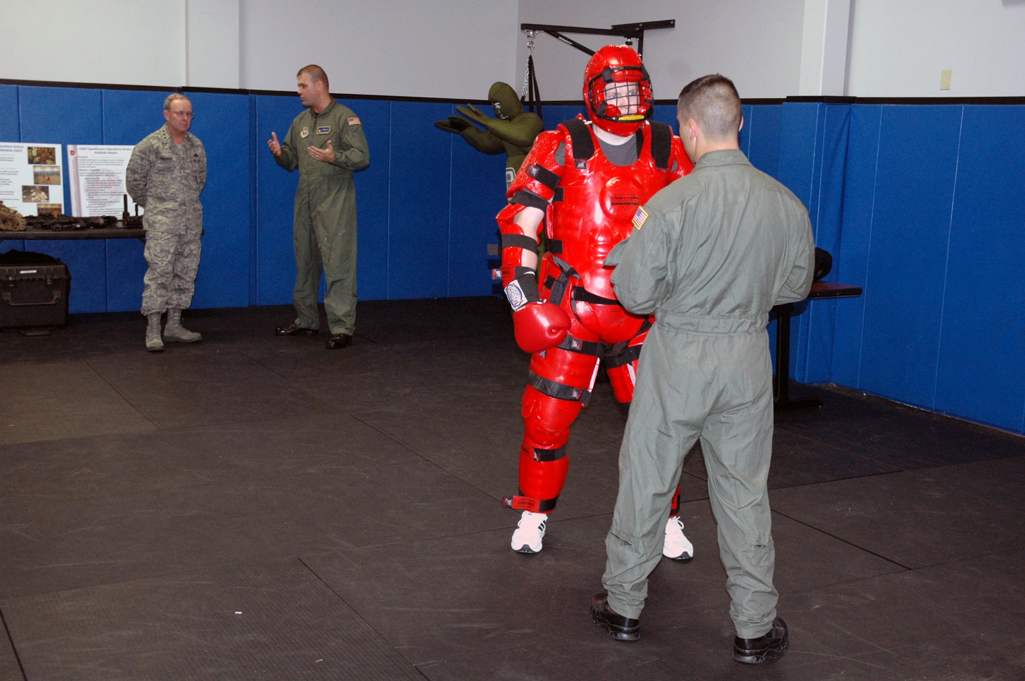 Lt. Gen. Kevin J. Sullivan, Deputy Chief of Staff for Logistics, Installations and Mission Support, Headquarters U.S. Air Force, Washington, D.C., talks with Tech. Sgt. Daniel Koenigsmann, Raven instructor with the 421st Combat Training Squadron, about Phoenix Raven training during a visit to the U.S. Air Force Expeditionary Center Aug. 3, 2007, at Fort Dix, N.J.  General Sullivan is responsible to the Chief of Staff for leadership, management and integration of Air Force logistics readiness, aircraft and missile maintenance, civil engineering and security forces, as well as setting policy and preparing budget estimates that reflect enhancements to productivity, combat readiness and quality of life for Air Force people.  (U.S. Air Force Photo/Tech. Sgt. Scott T. Sturkol)