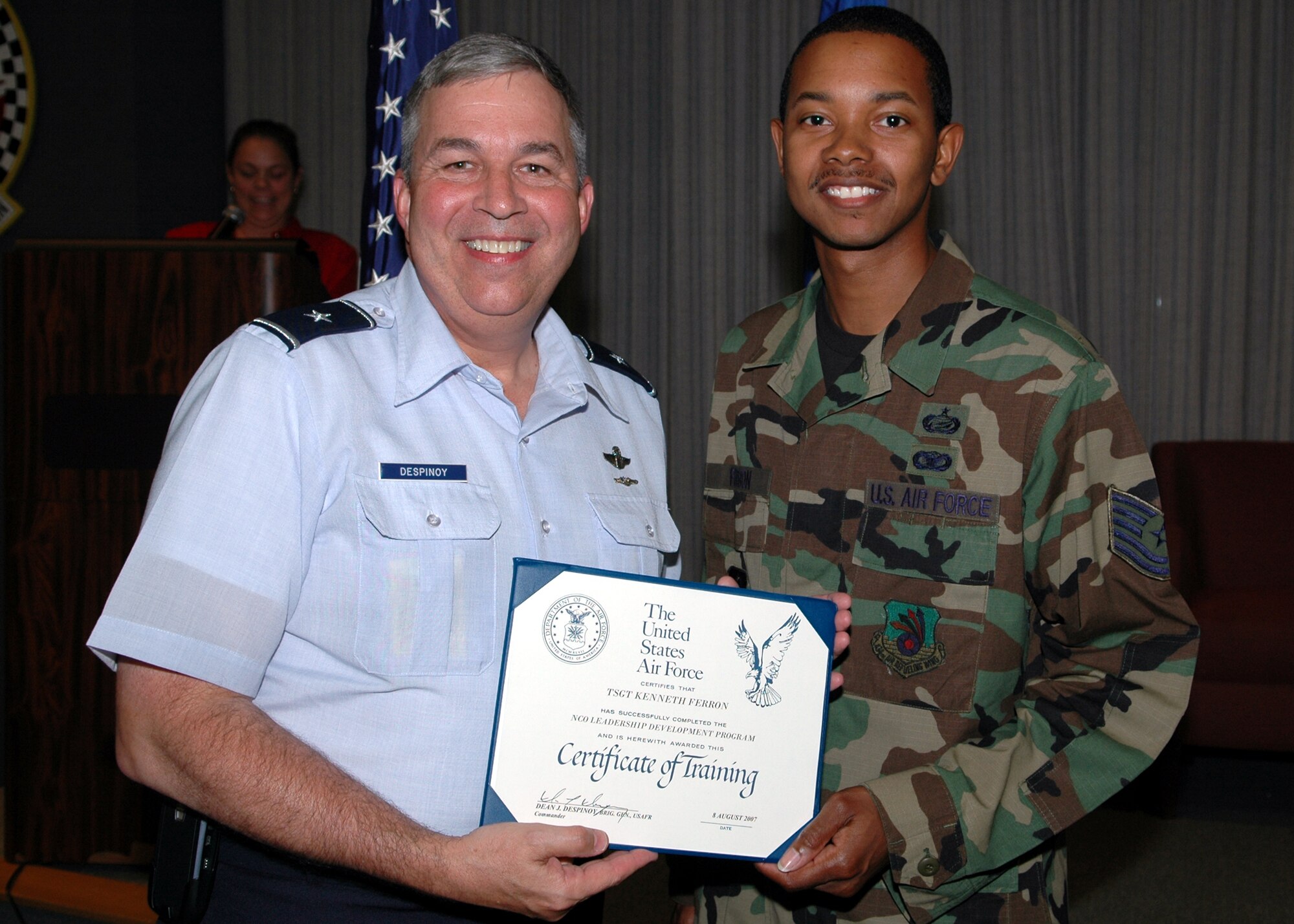 GRISSOM AIR RESERVE BASE, Ind., -- Brig. Gen. Dean Despinoy, 434th Air Refueling Wing commander, left, presents a diploma to Tech. Sgt. Kenneth Ferron, 434th Mission Support Flight, upon his graduation from the Noncommissioned Officer Leadership Development Program. (U.S. Air Force photo/Tech. Sgt. Doug Hays)