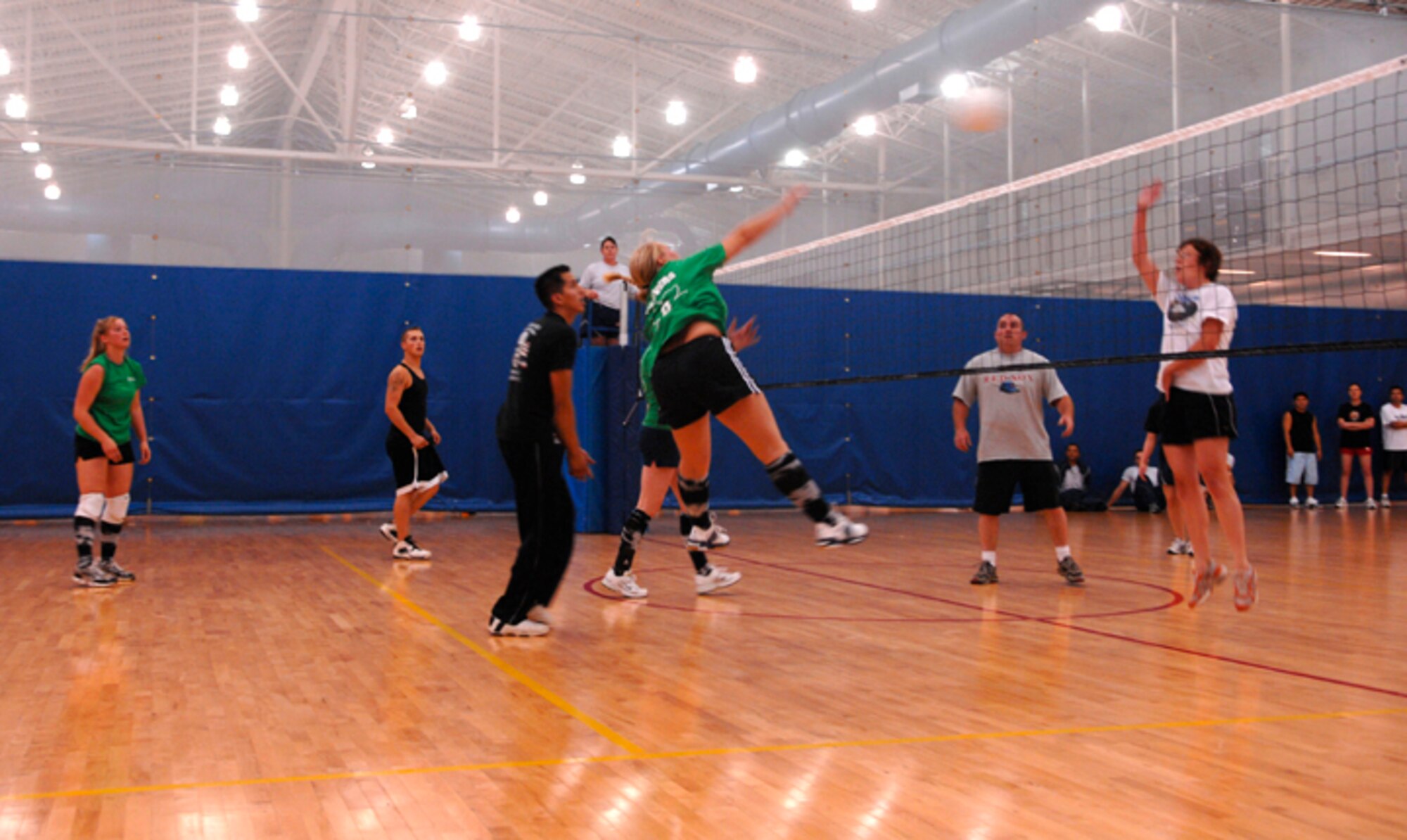 MINOT AIR FORCE BASE, N.D. -- Staff Sgt. Tiffany Salinas, 91st Missile Security Forces Squadron, slams the ball across the net for a point during a game against the 5th Maintenance Group at the McAdoo Fitness Center here. Sergeant Salinas' team swept the 5th MXG two out of three games. Volleyball is one of the many activities offered during the base's annual sports day. (U.S. Air Force photo by Senior Airman Christopher Boitz)